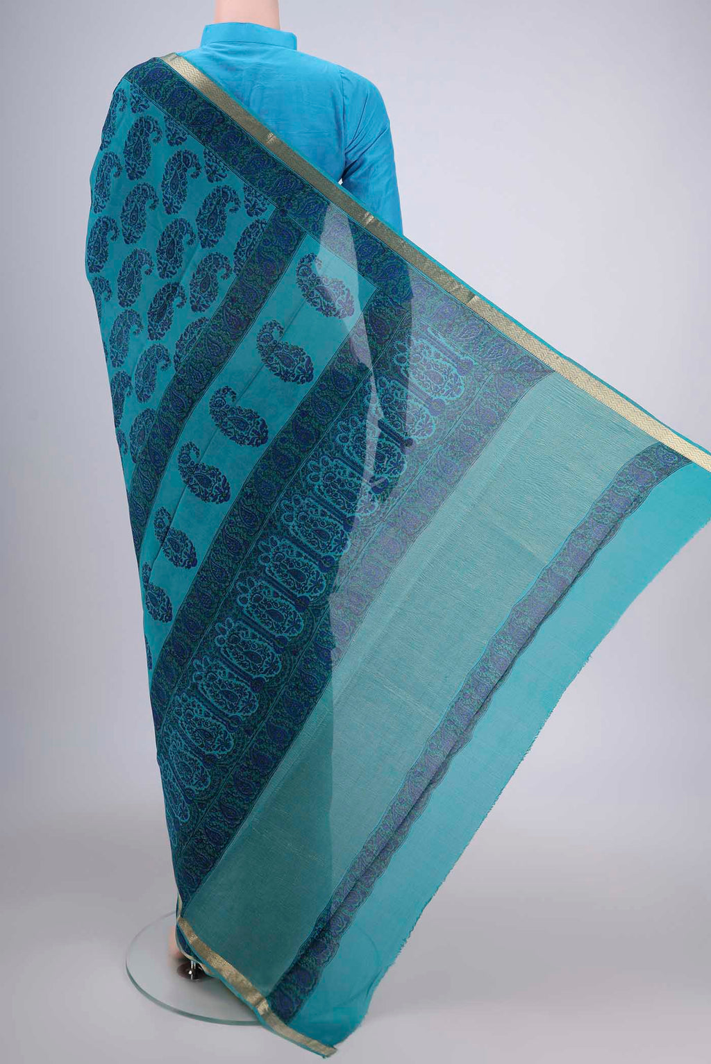 Flat view of Teal Mysore Crepe Saree with Floral Print on the body and Zari Border. 
