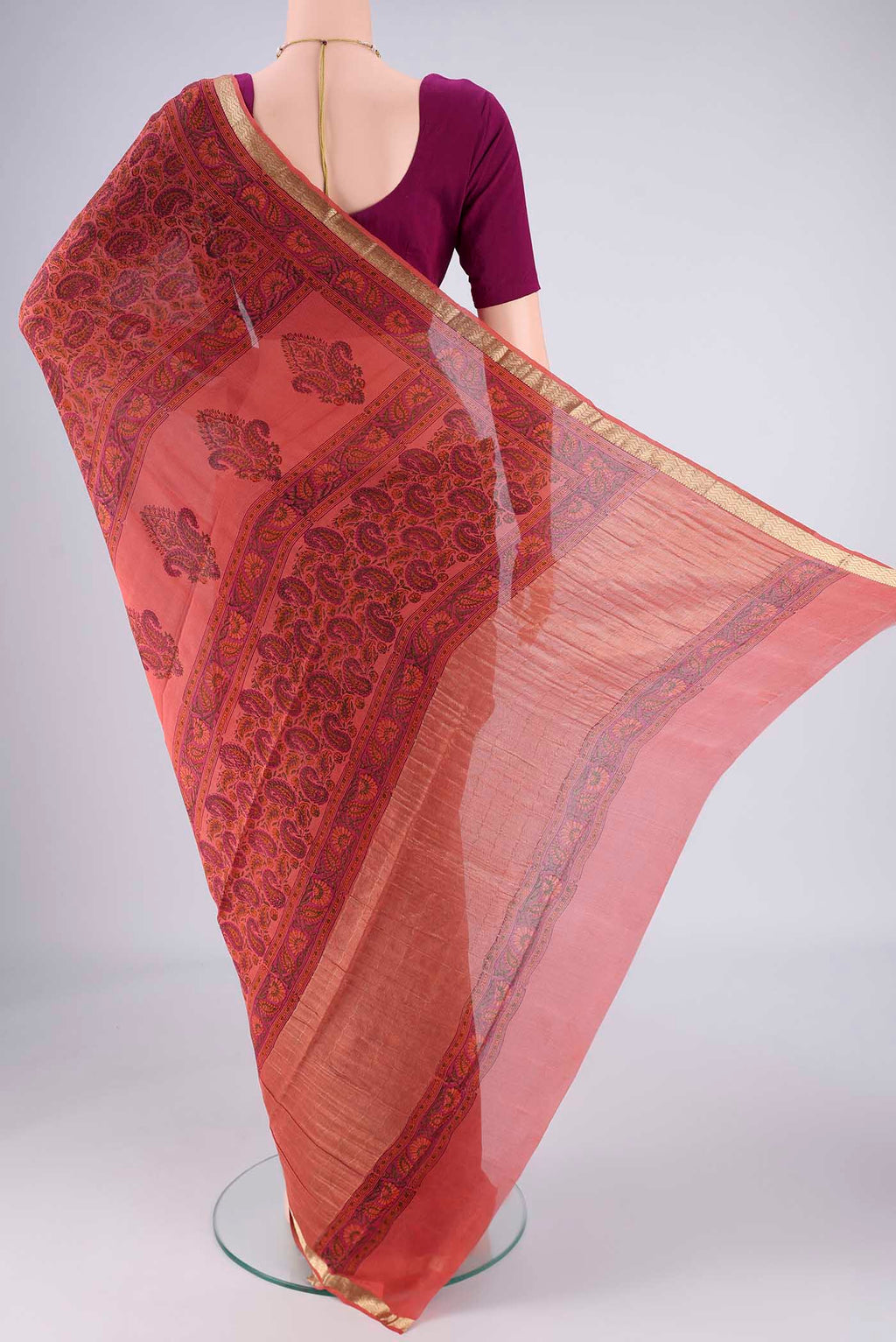 Flat view of Coral Mysore Crepe Saree with Printed design on the body and Zari Border. 