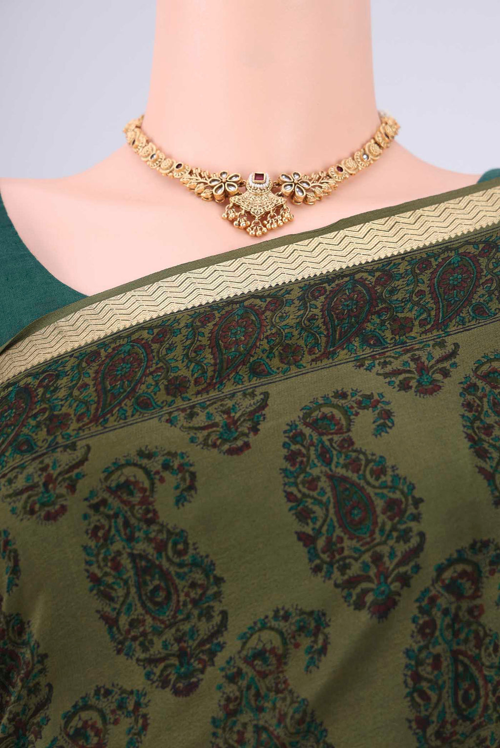 Border image of Olive Green Mysore Crepe Saree with Printed design on the body and Zari Border. 