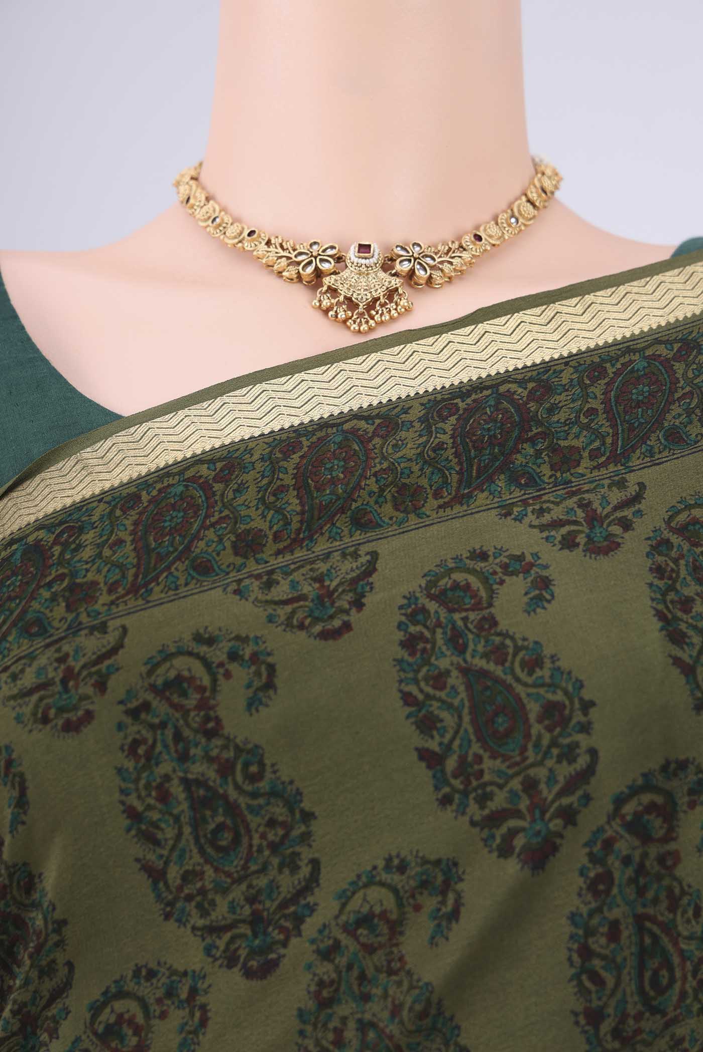 Border image of Olive Green Mysore Crepe Saree with Printed design on the body and Zari Border. 
