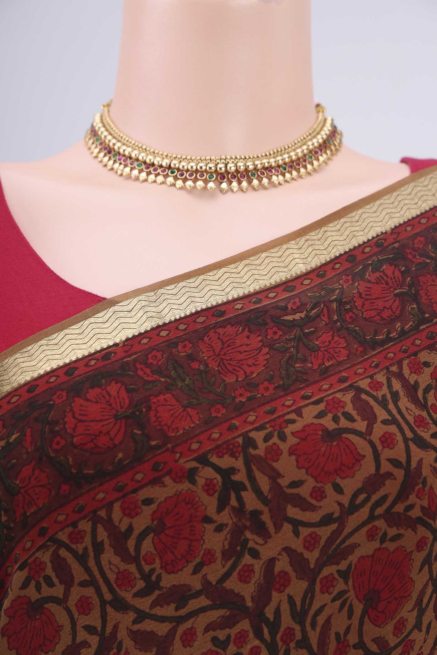 Border image of Dark Beige Mysore Crepe Saree with Floral Print on the body and Zari Border. 