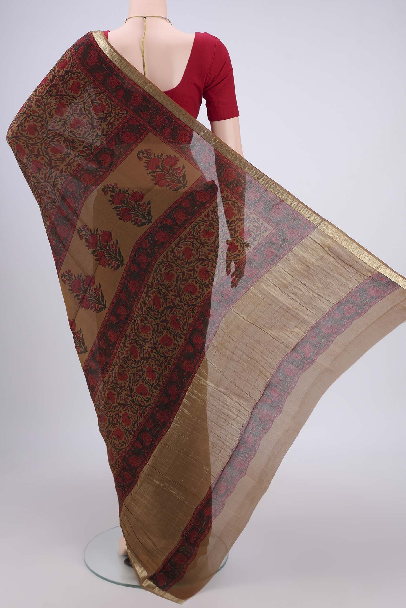 Flat view of Dark Beige Mysore Crepe Saree with Floral Print on the body and Zari Border. 