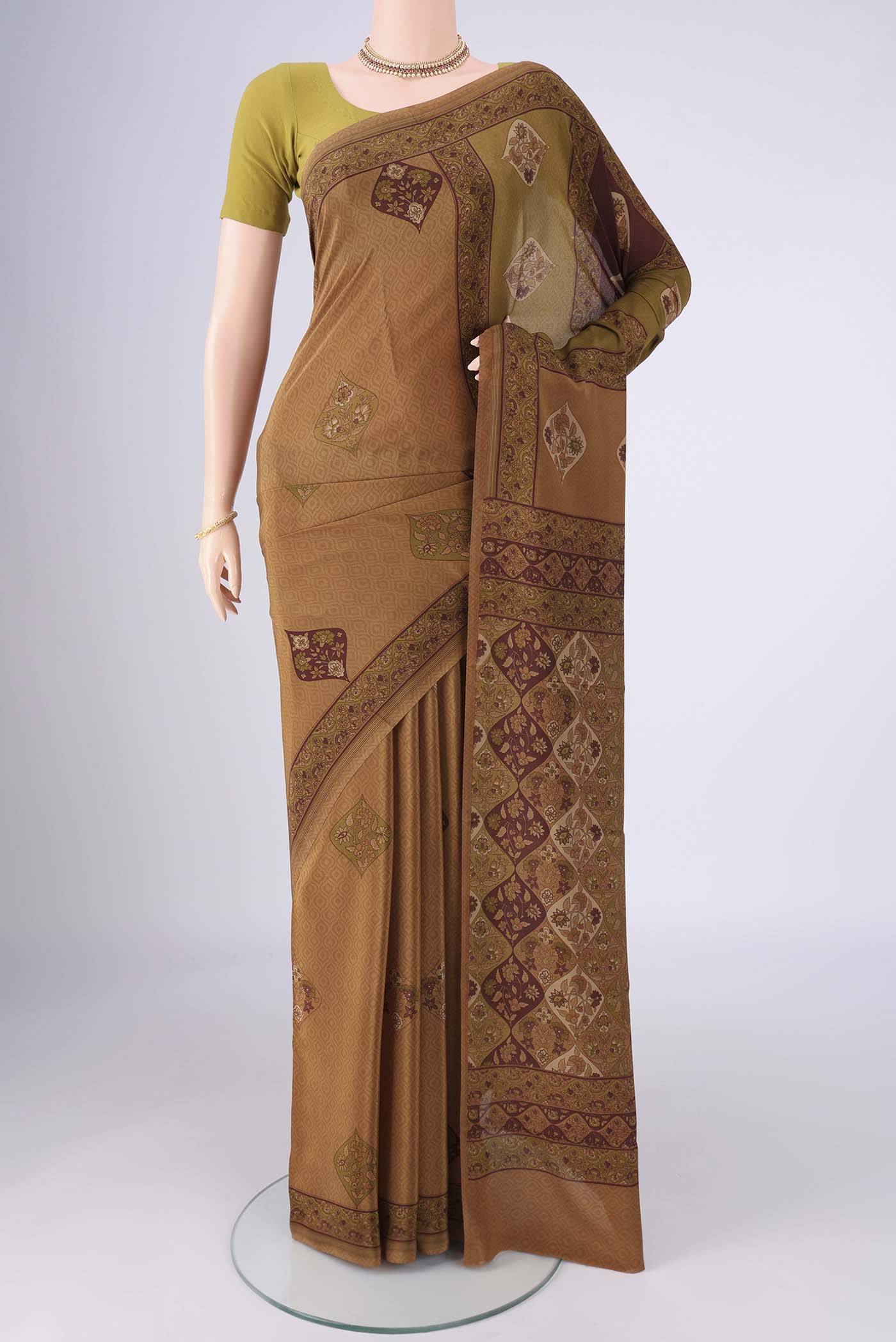 Brown Mysore Crepe Saree with Geometric Print on the body and Printed Border.  displayed on a mannequin