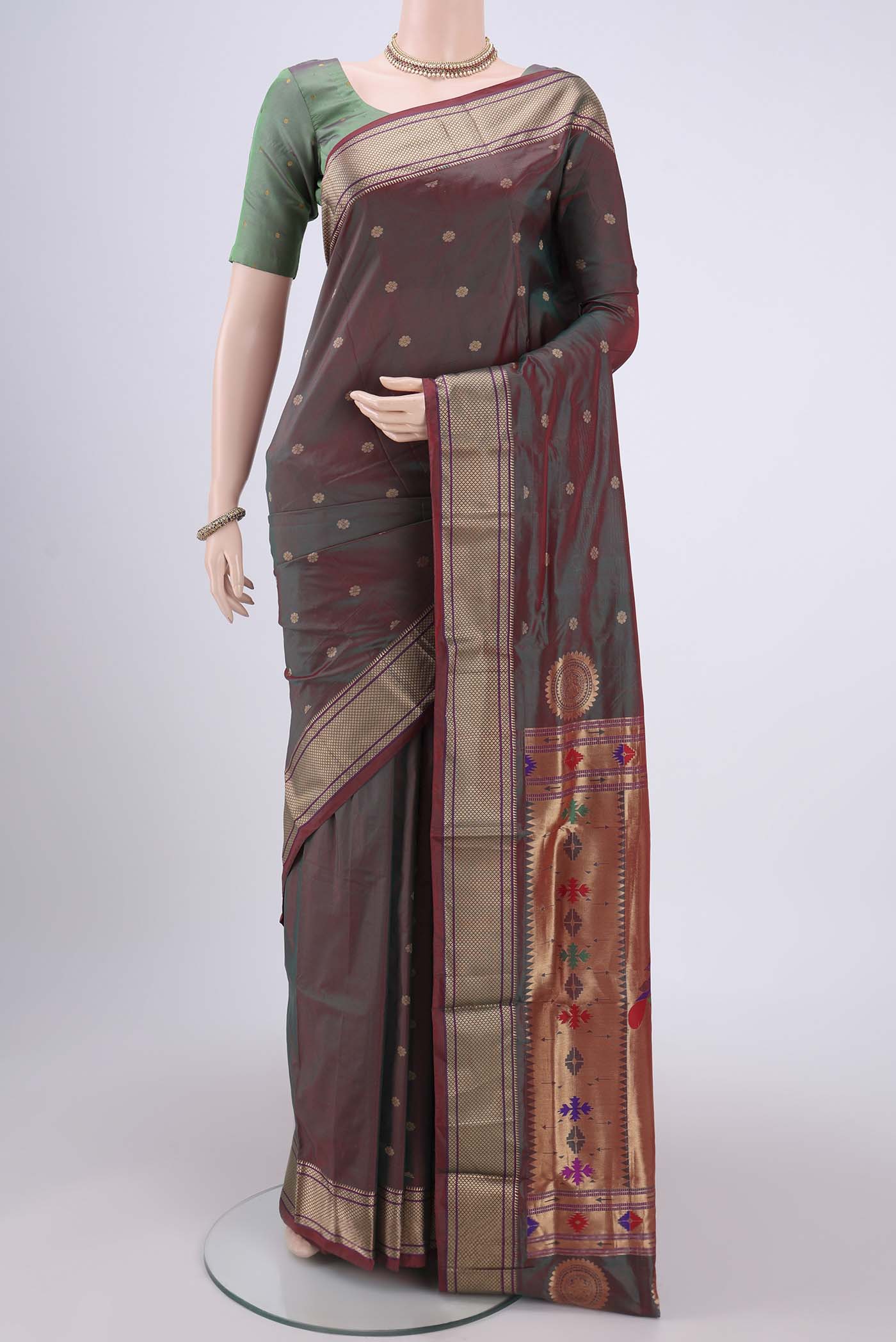 Maroon Dual Tone Blended Bangalore Silk Saree with Zari Butta on the body and Paithani Border.  displayed on a mannequin