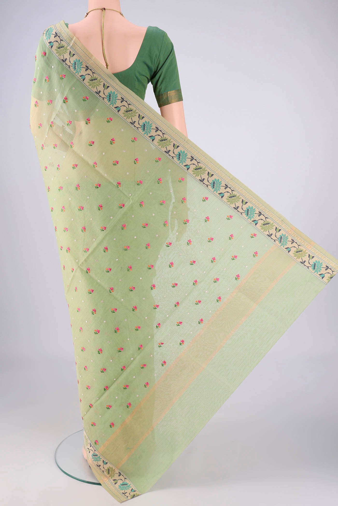 Flat view of Light Green Blended Kota Cotton Saree with Embroidery on the body and Embroidery Border. 