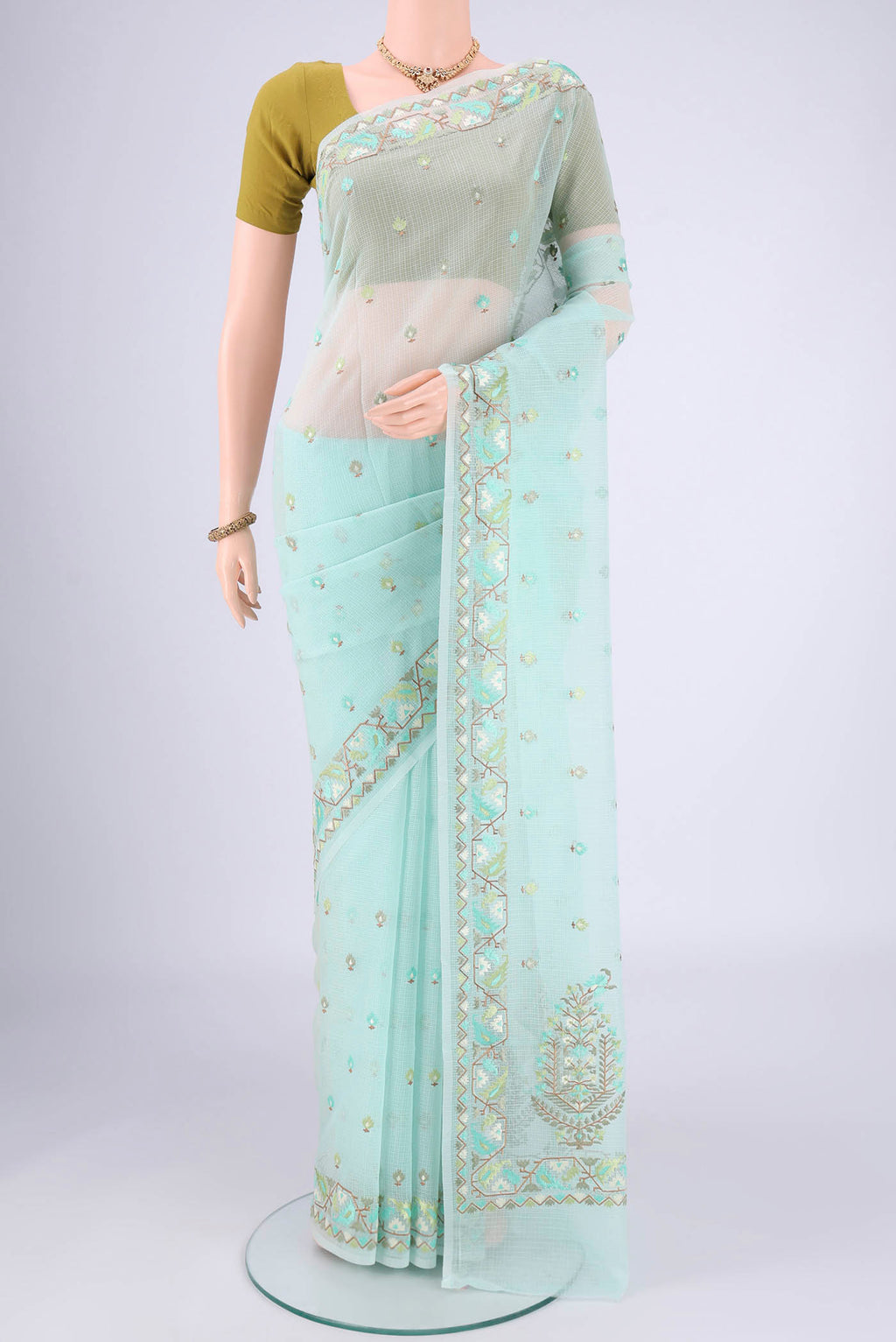 Sky Blue Blended Kota Cotton Saree with Embroidery on the body and Thread Border.  displayed on a mannequin