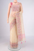 Cream Blended Kota Cotton Saree with Embroidery on the body and Thread Border.  displayed on a mannequin