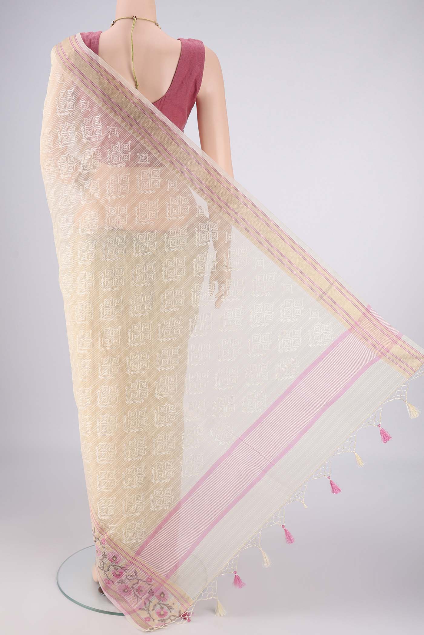 Flat view of Cream Blended Kota Cotton Saree with Embroidery on the body and Thread Border. 