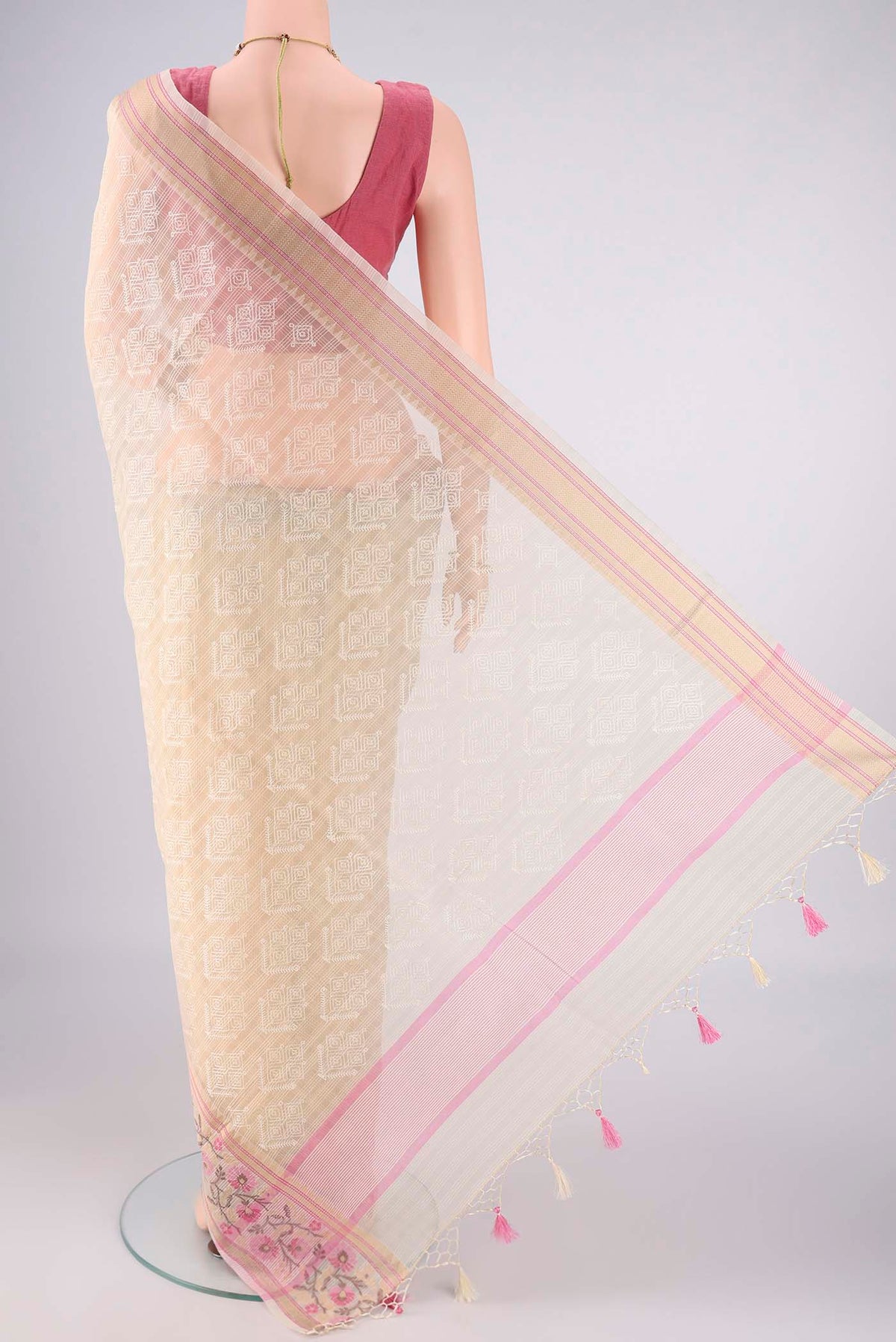 Flat view of Cream Blended Kota Cotton Saree with Embroidery on the body and Thread Border. 