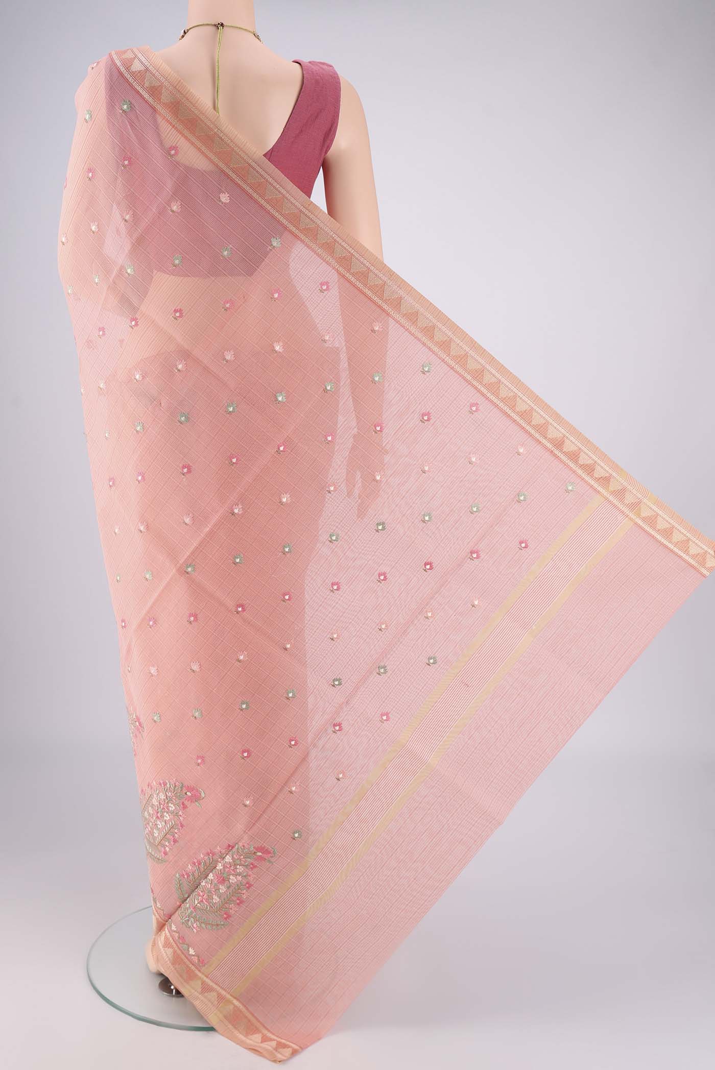 Flat view of Peach Blended Kota Cotton Saree with Embroidery on the body and Thread Border. 