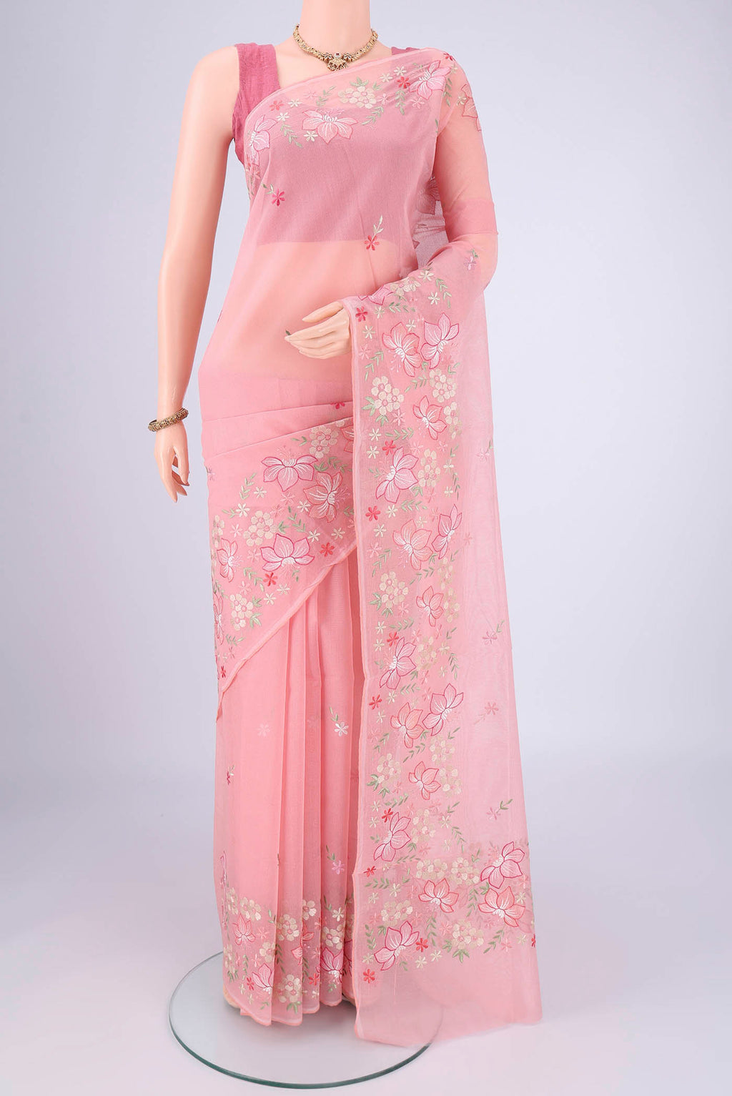 Peach Blended Kota Cotton Saree with Embroidery on the body and Thread Border.  displayed on a mannequin