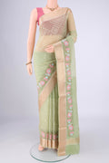 Light Green Blended Kota Cotton Saree with Embroidery on the body and Zari Border.  displayed on a mannequin