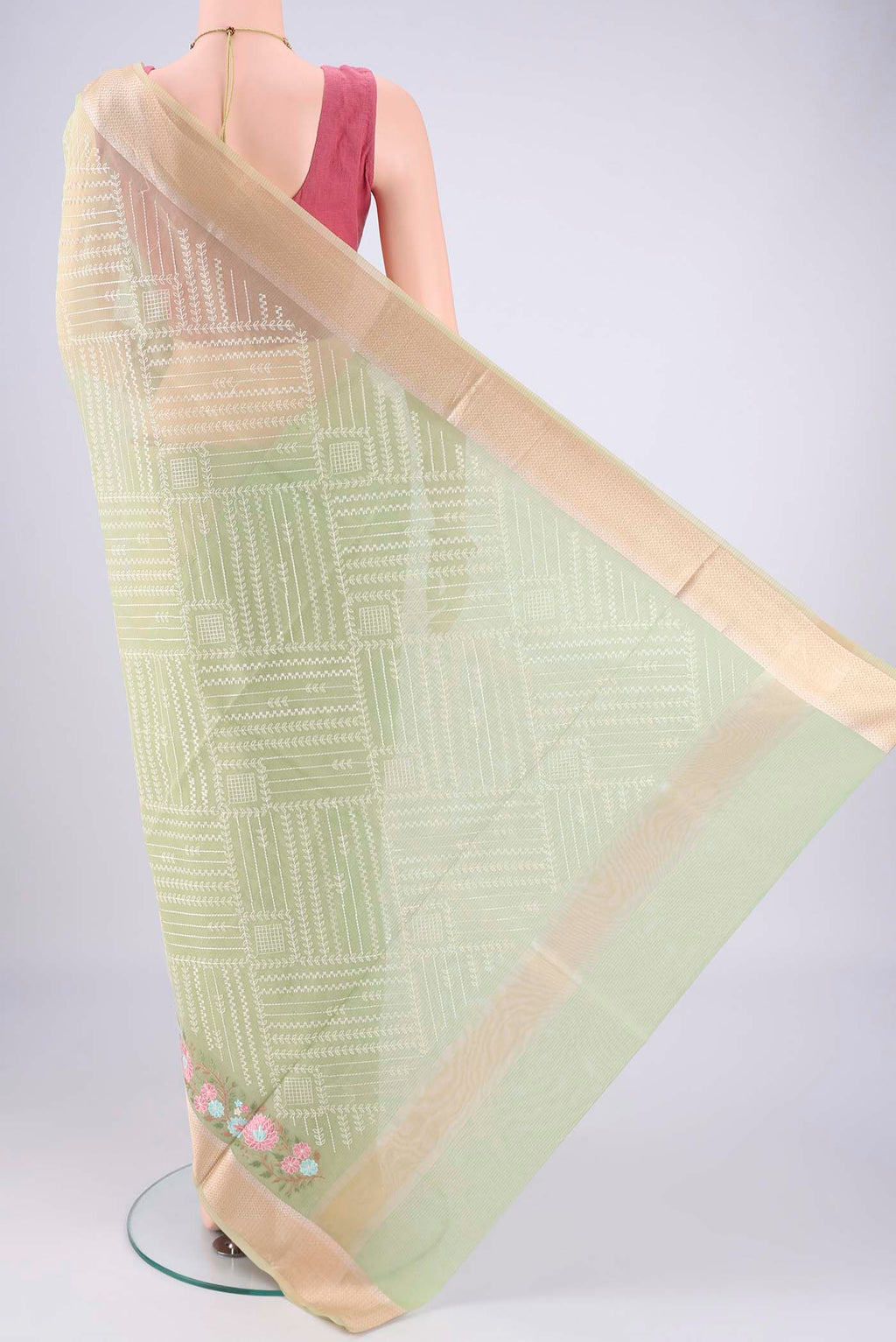 Flat view of Light Green Blended Kota Cotton Saree with Embroidery on the body and Zari Border. 