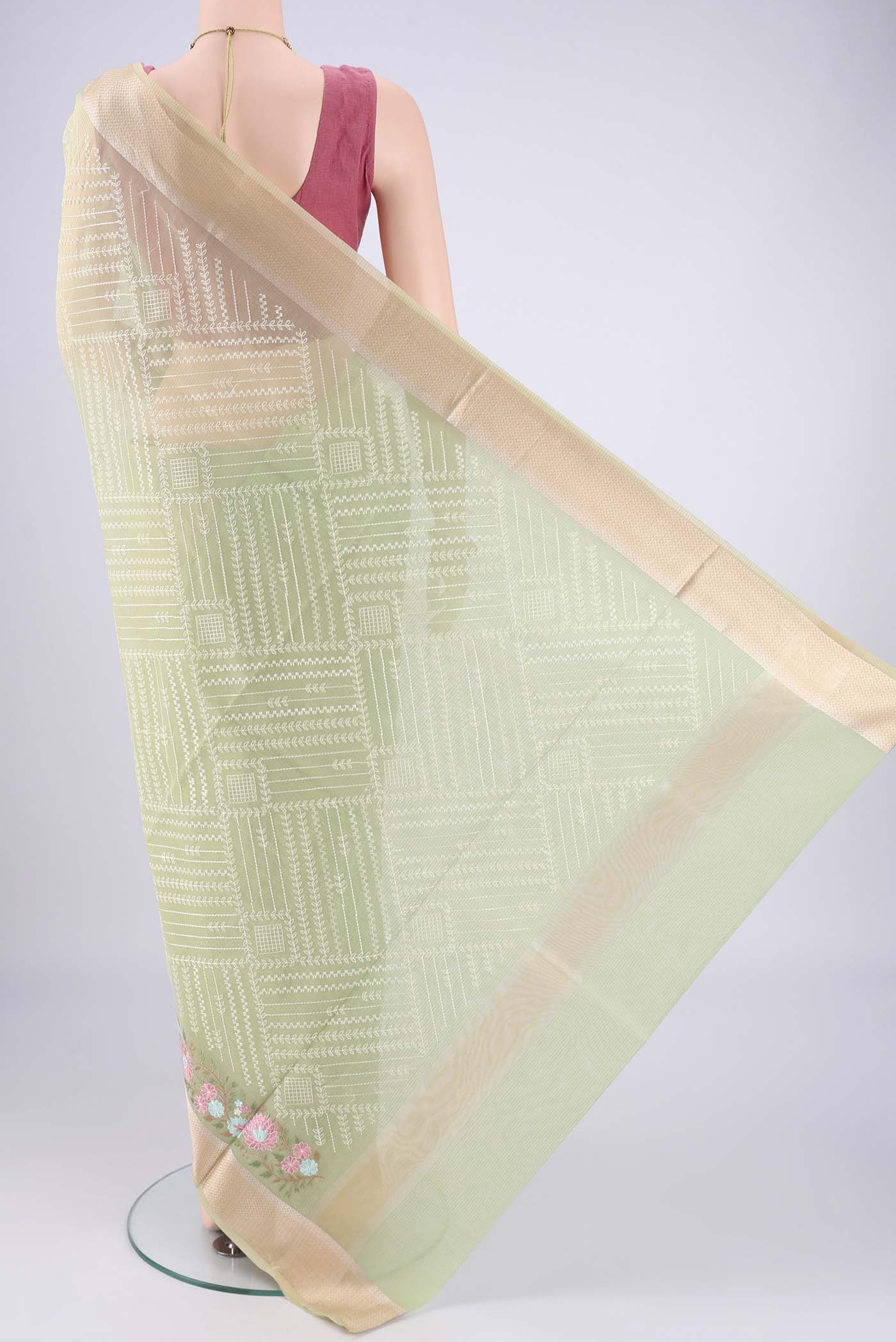 Flat view of Light Green Blended Kota Cotton Saree with Embroidery on the body and Zari Border. 