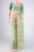 Light Green Blended Kota Cotton Saree with Embroidery on the body and Zari Border.  displayed on a mannequin