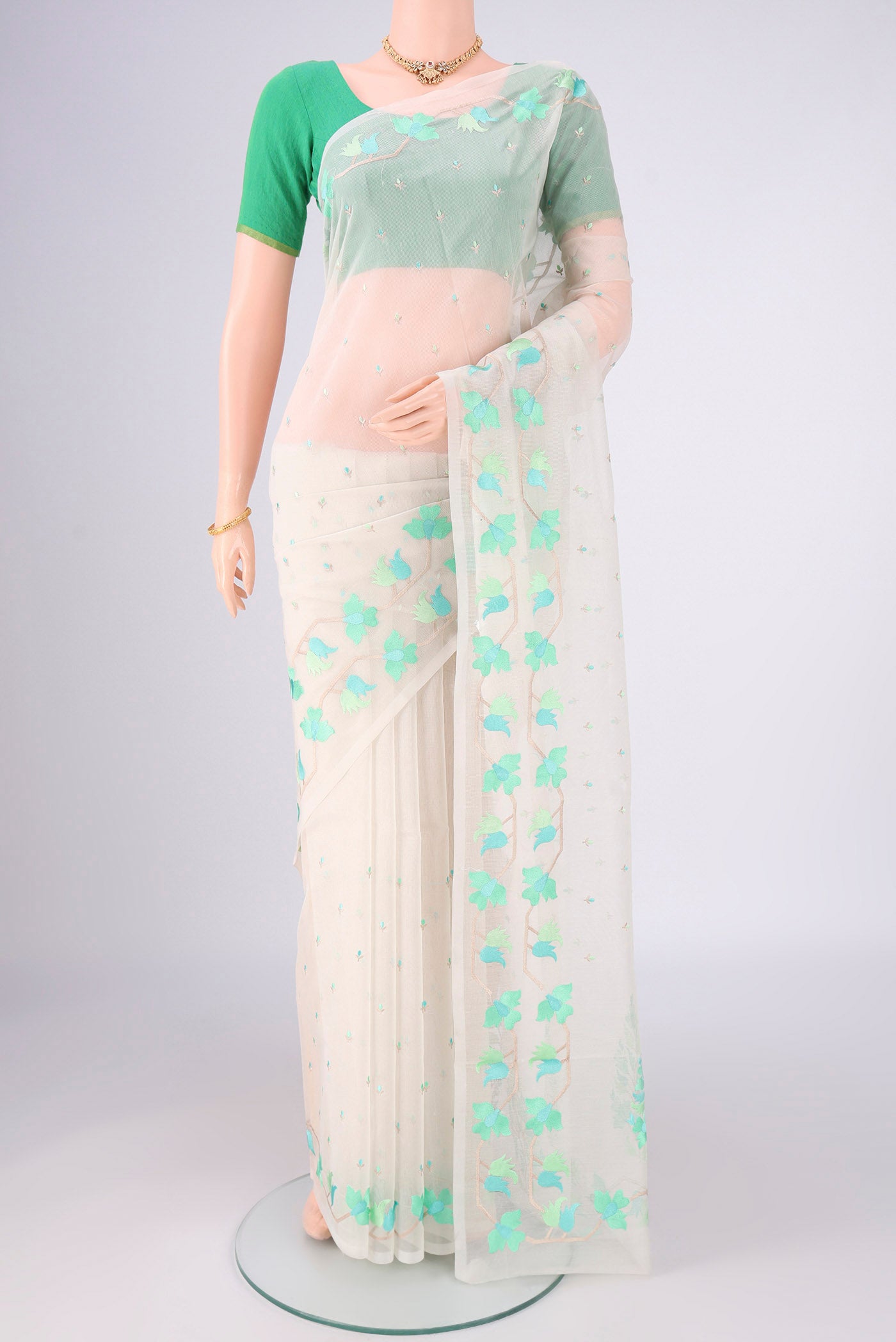 White Blended Kota Cotton Saree with Embroidery on the body and Thread Border.  displayed on a mannequin