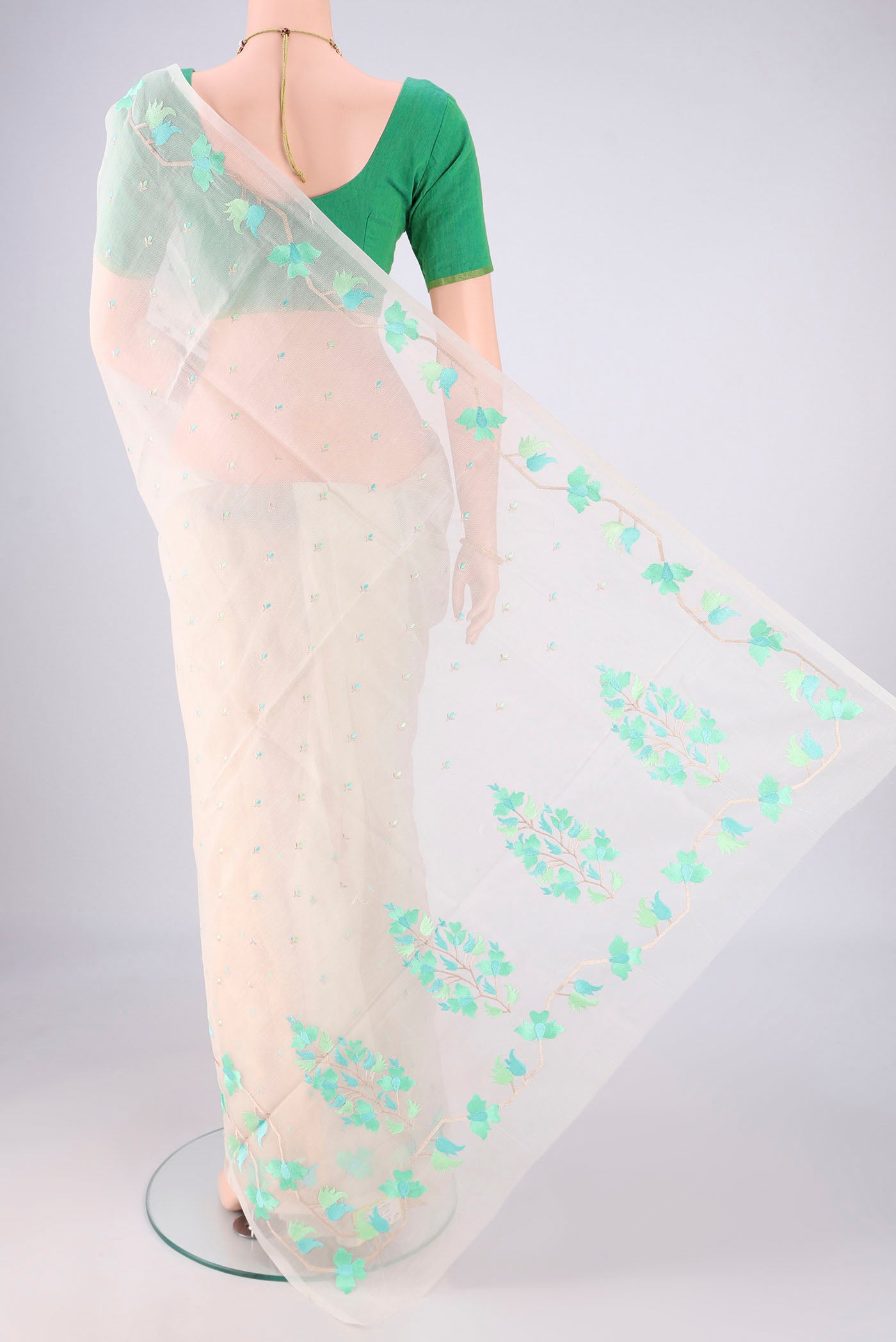 Flat view of White Blended Kota Cotton Saree with Embroidery on the body and Thread Border. 