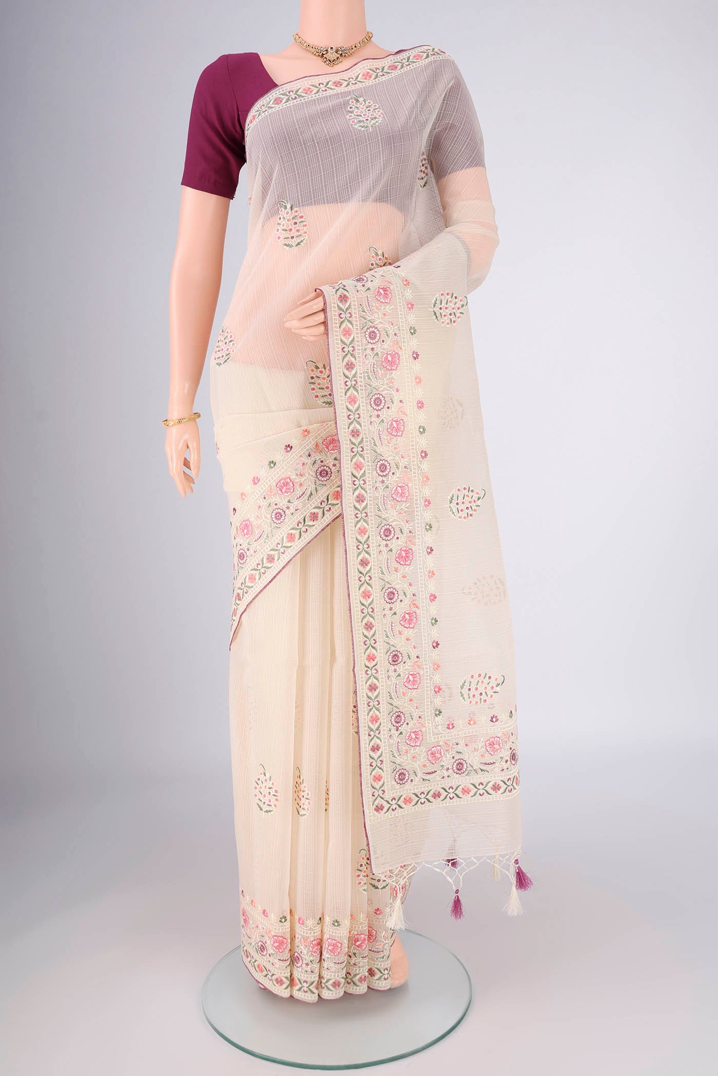 Off White Dual Tone Blended Kota Cotton Saree with Embroidery on the body and Thread Border.  displayed on a mannequin