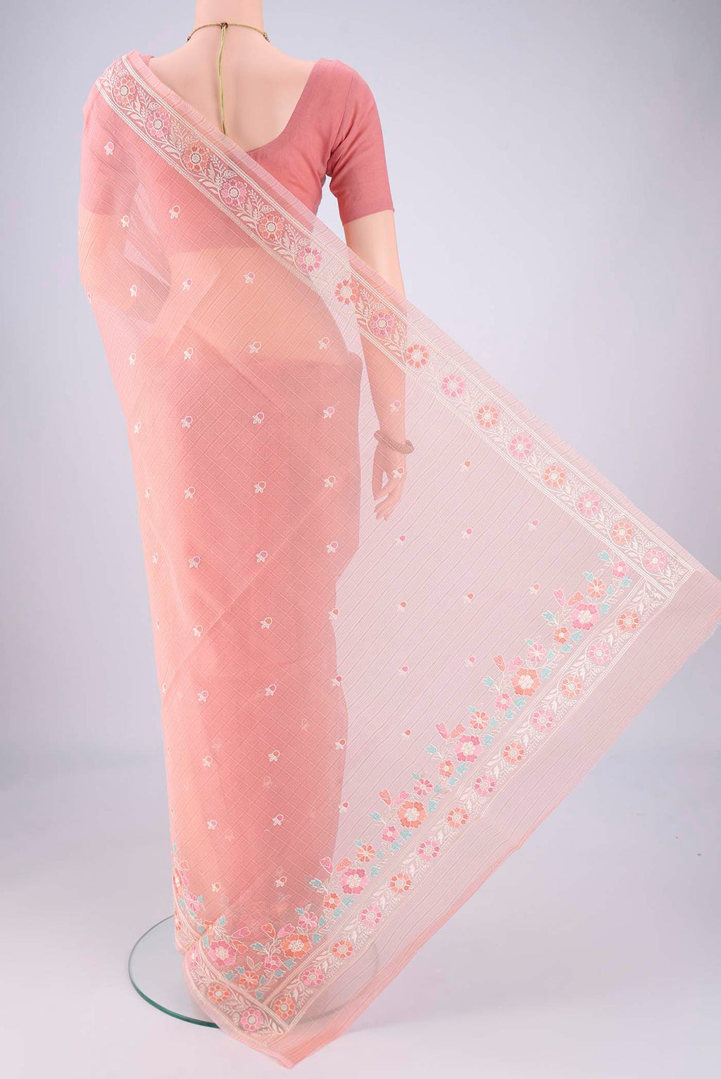 Flat view of Peach Blended Kota Cotton Saree with Embroidery on the body and Thread Border. 