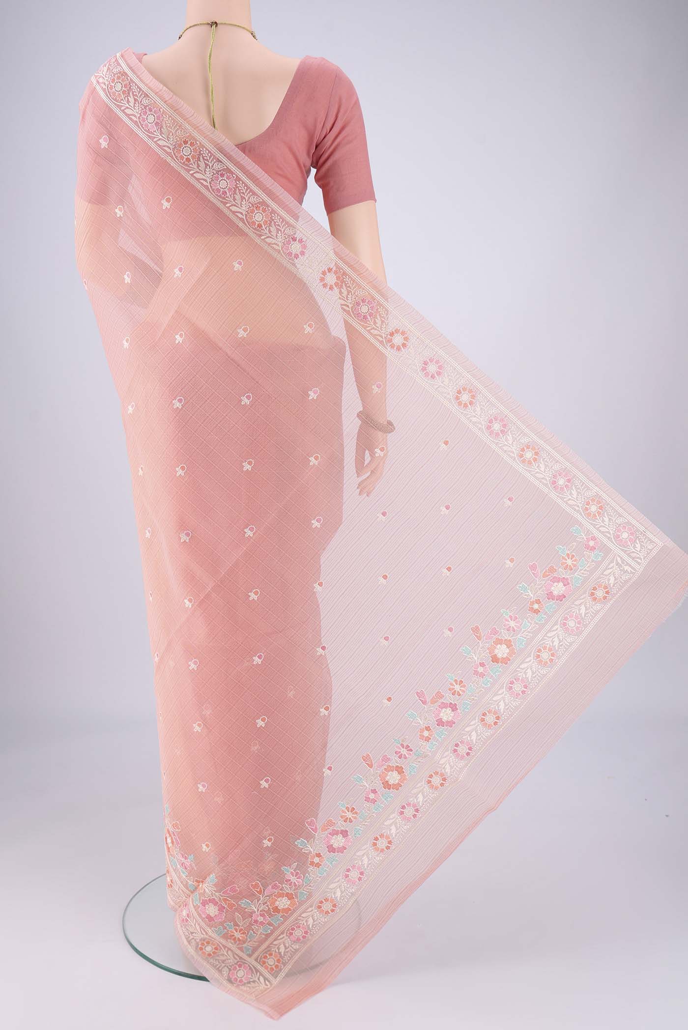 Flat view of Peach Blended Kota Cotton Saree with Embroidery on the body and Thread Border. 