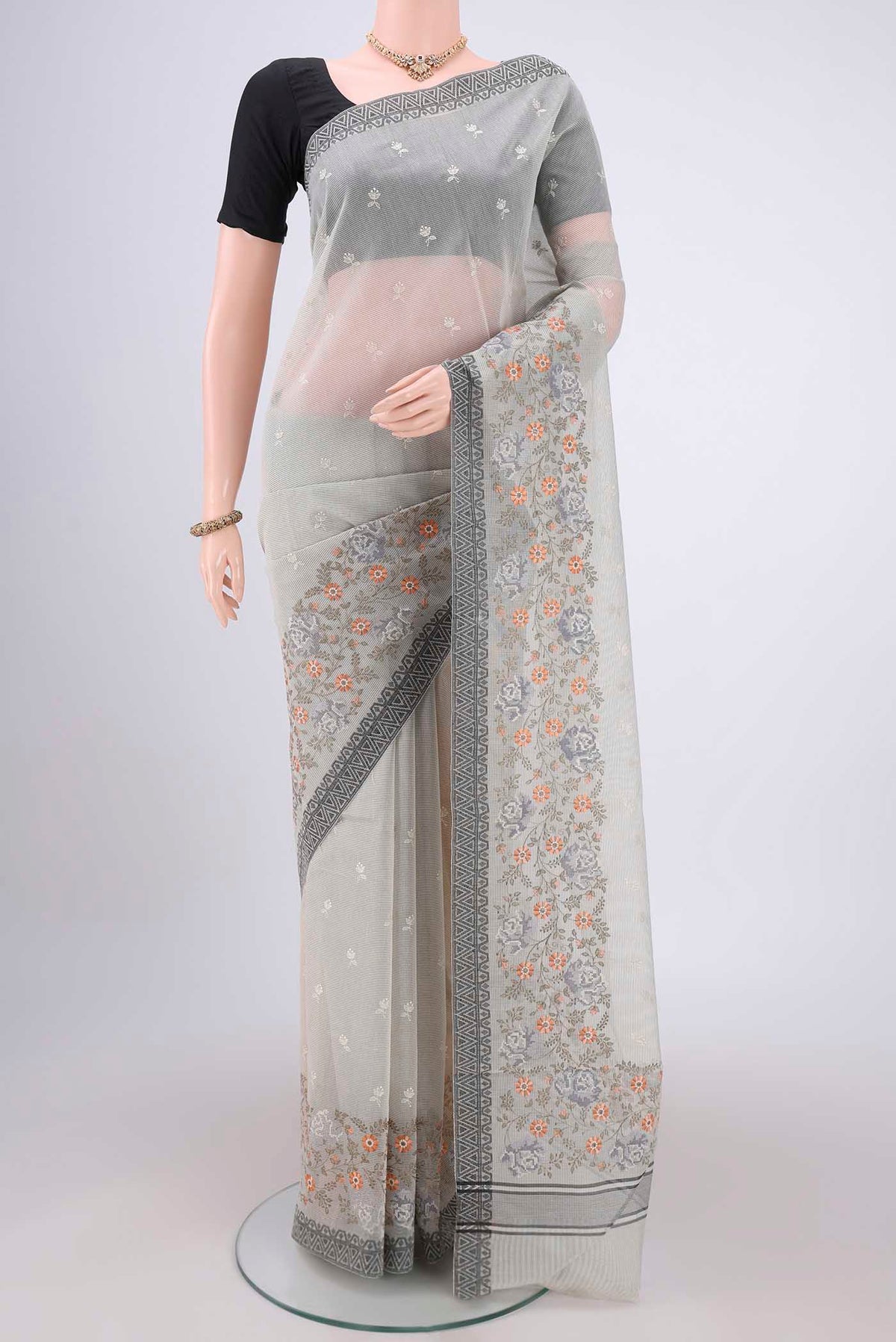 Off White Kota Cotton Saree with Embroidery on the body and Thread Border.  displayed on a mannequin