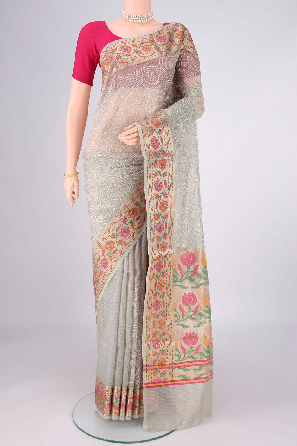 Grey Blended Kota Cotton Saree with Embroidery on the body and Zari Border.  displayed on a mannequin