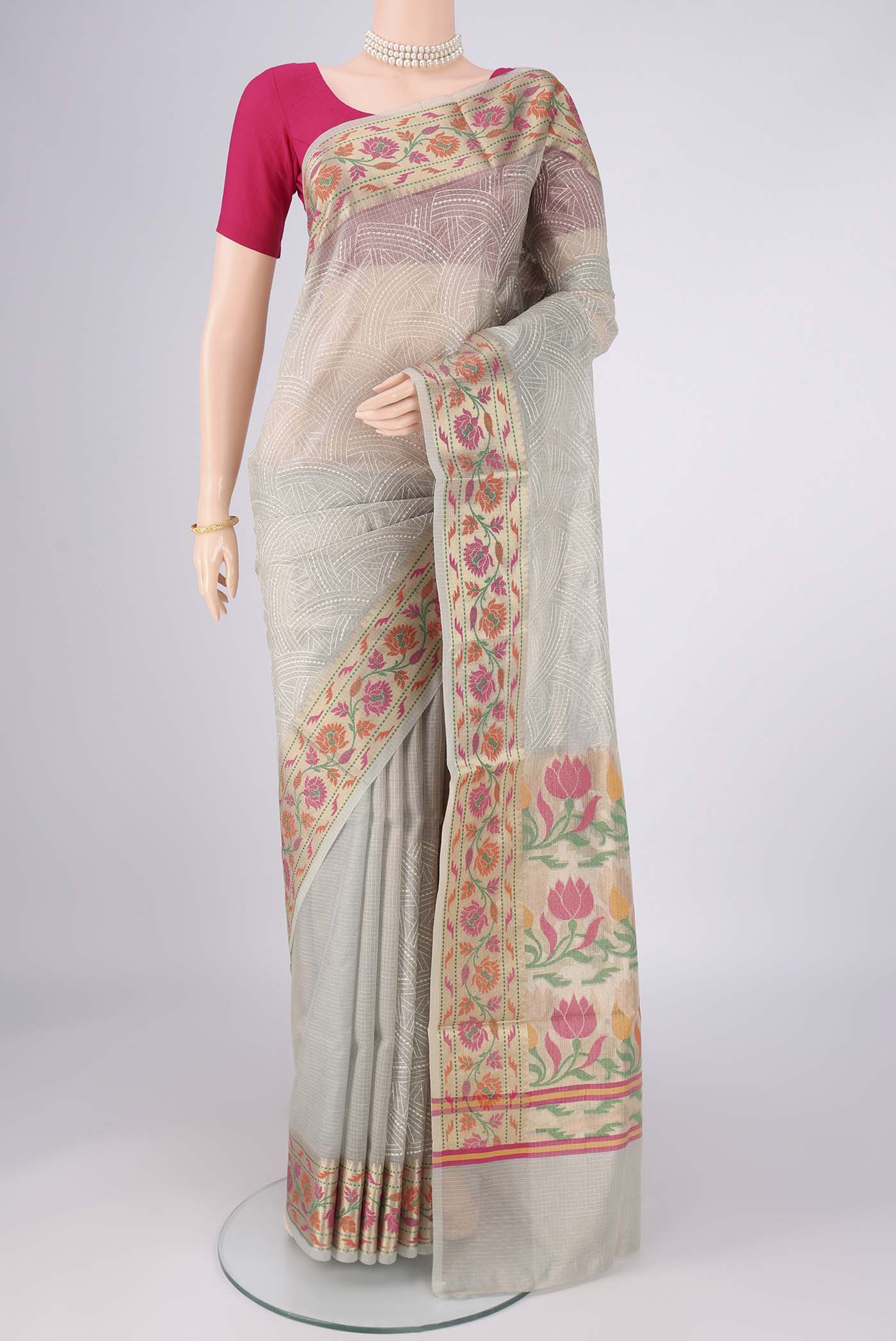 Grey Blended Kota Cotton Saree with Embroidery on the body and Zari Border.  displayed on a mannequin