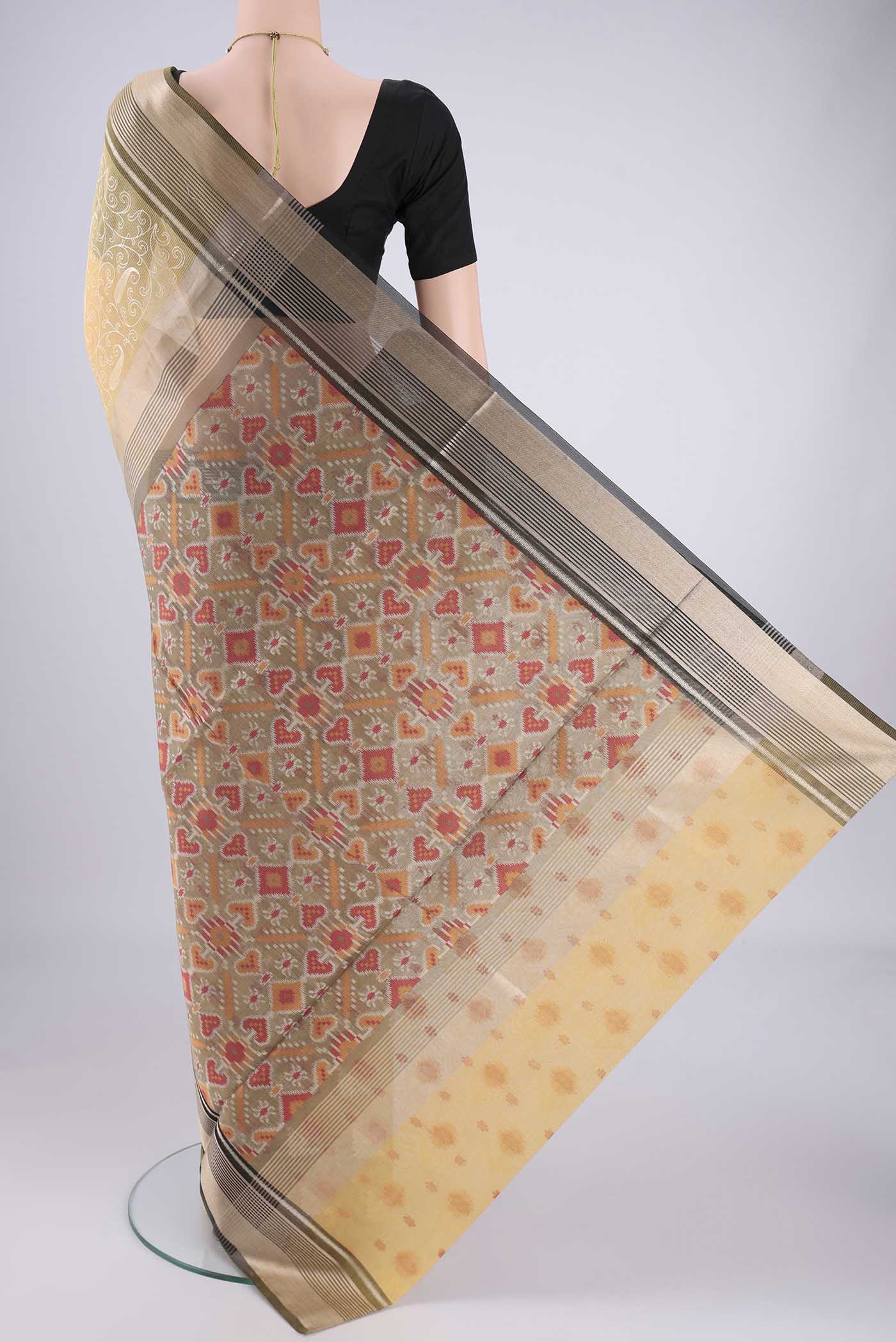 Flat view of Yellow Blended Kota Cotton Saree with Embroidery on the body and Zari Border. 