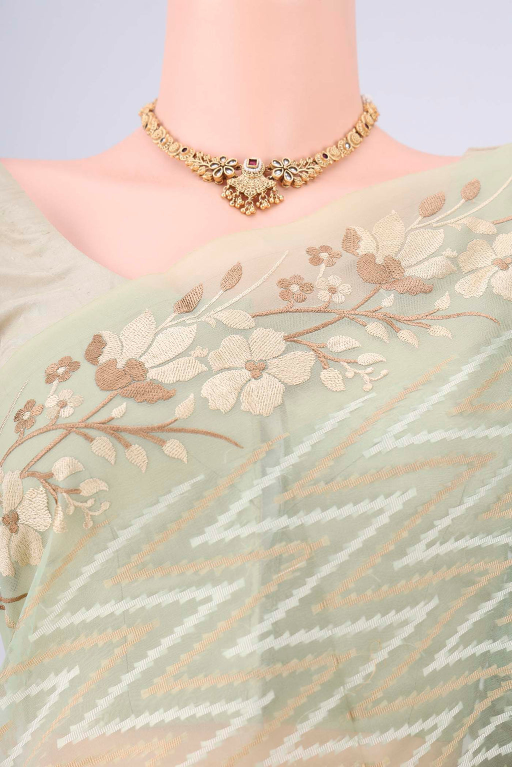 Border image of Pista Green Blended Kota Cotton Saree with Embroidery on the body and Thread Border. 