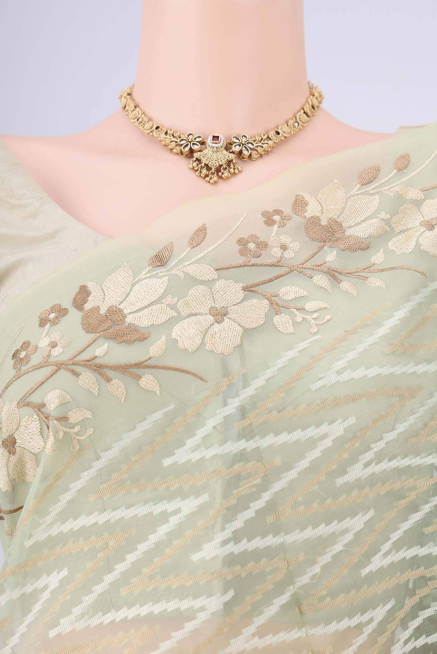 Border image of Pista Green Blended Kota Cotton Saree with Embroidery on the body and Thread Border. 