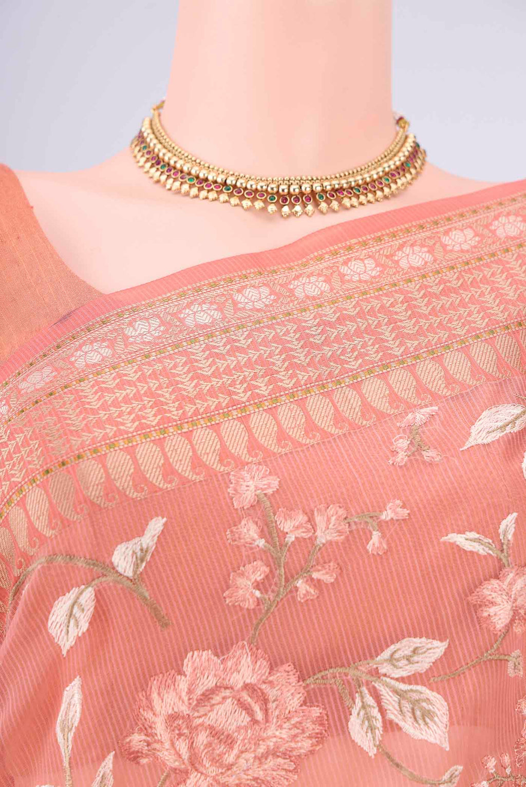 Border image of Peach Blended Kota Cotton Saree with Embroidery on the body and Thread Border. 