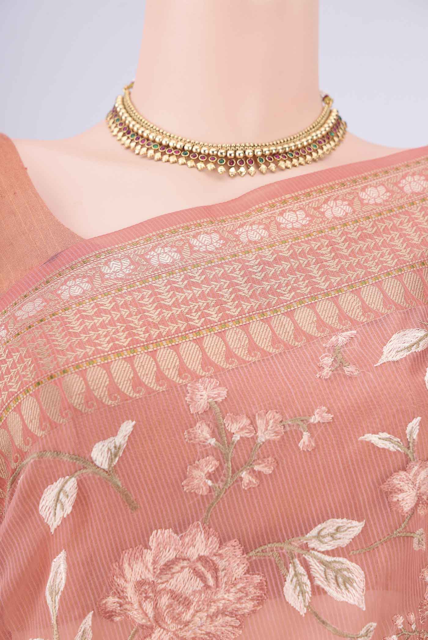 Border image of Peach Blended Kota Cotton Saree with Embroidery on the body and Thread Border. 