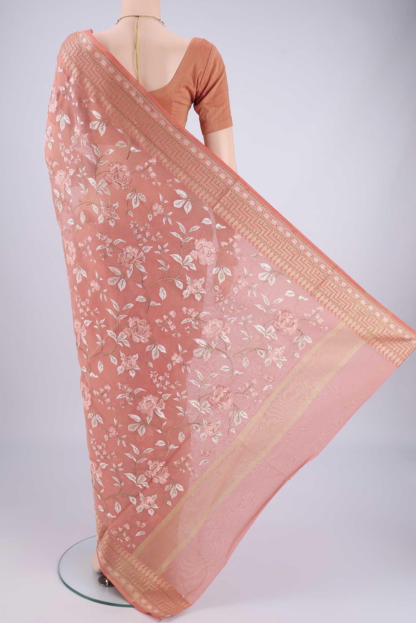 Flat view of Peach Blended Kota Cotton Saree with Embroidery on the body and Thread Border. 