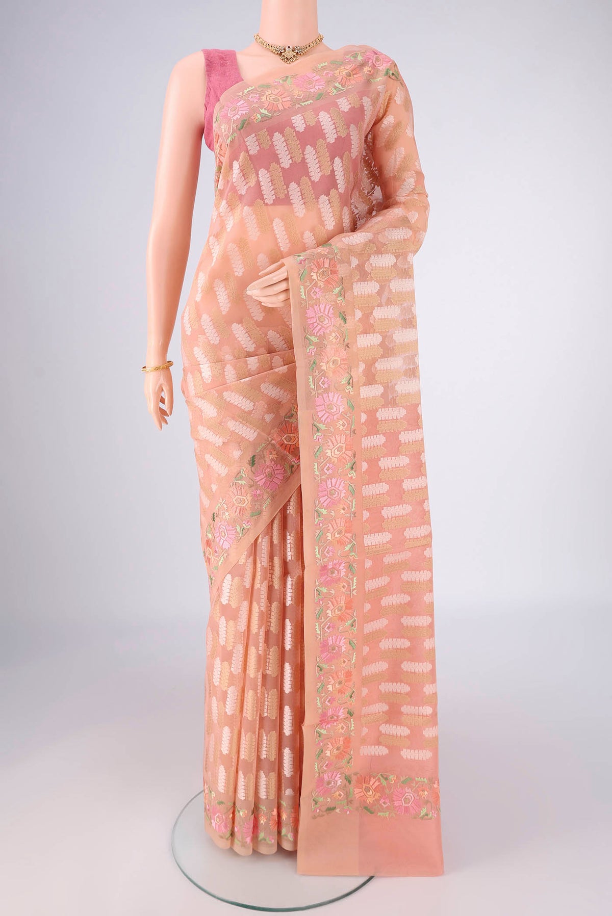 Peach Dual Tone Blended Kota Cotton Saree with Zari And Thread Butta on the body and Embroidery Border.  displayed on a mannequin