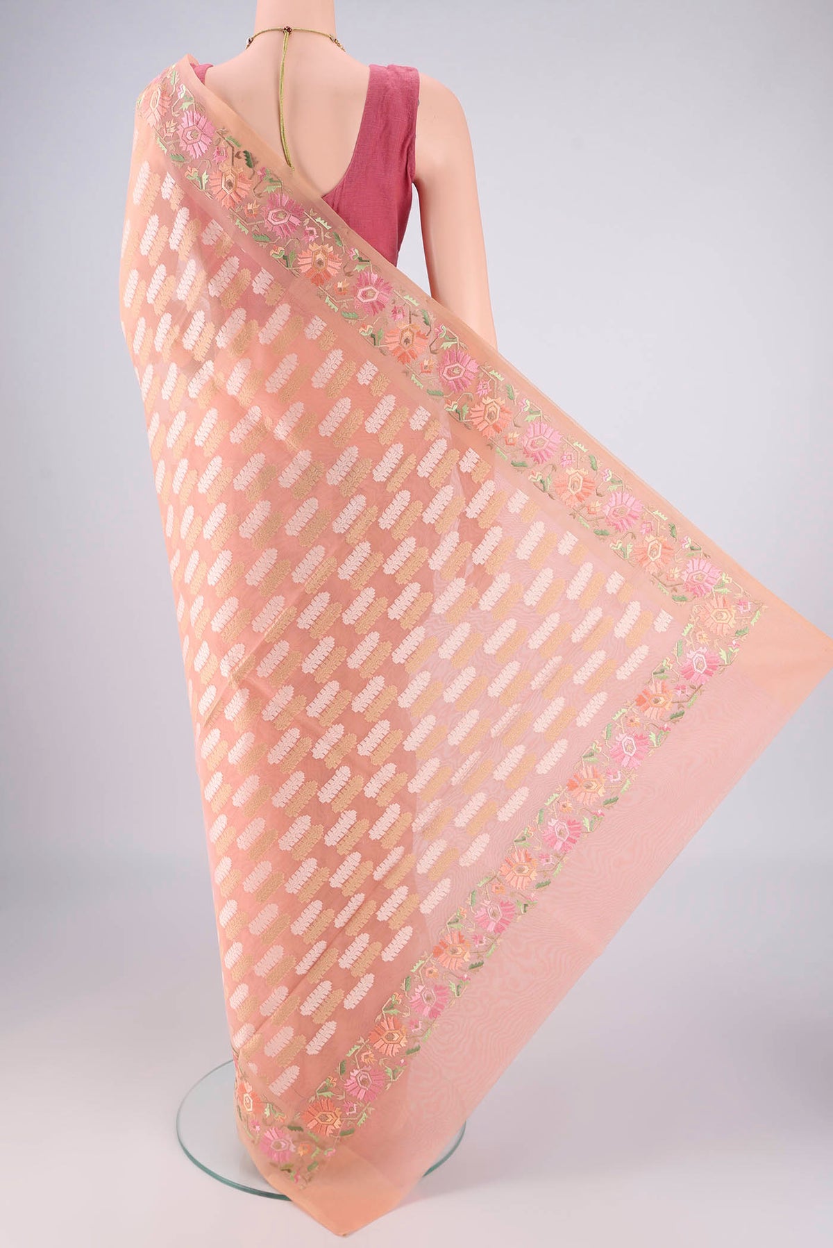 Flat view of Peach Dual Tone Blended Kota Cotton Saree with Zari And Thread Butta on the body and Embroidery Border. 