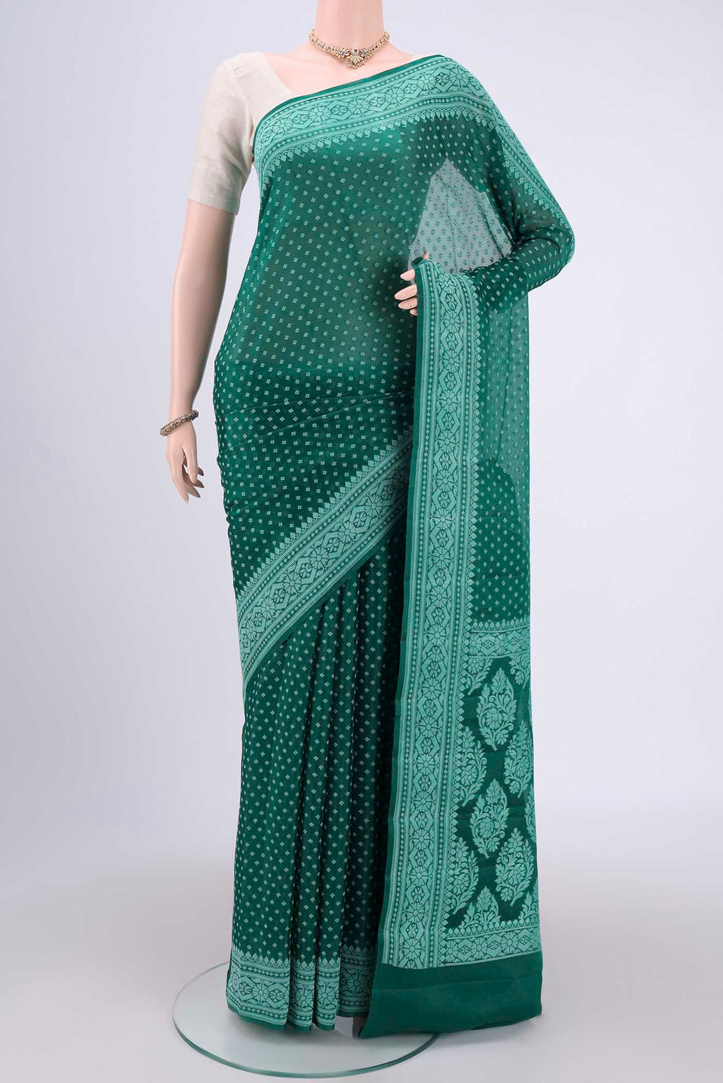 Green Blended Banarasi Georgette Saree with Thread Butta on the body and Thread Border.  displayed on a mannequin