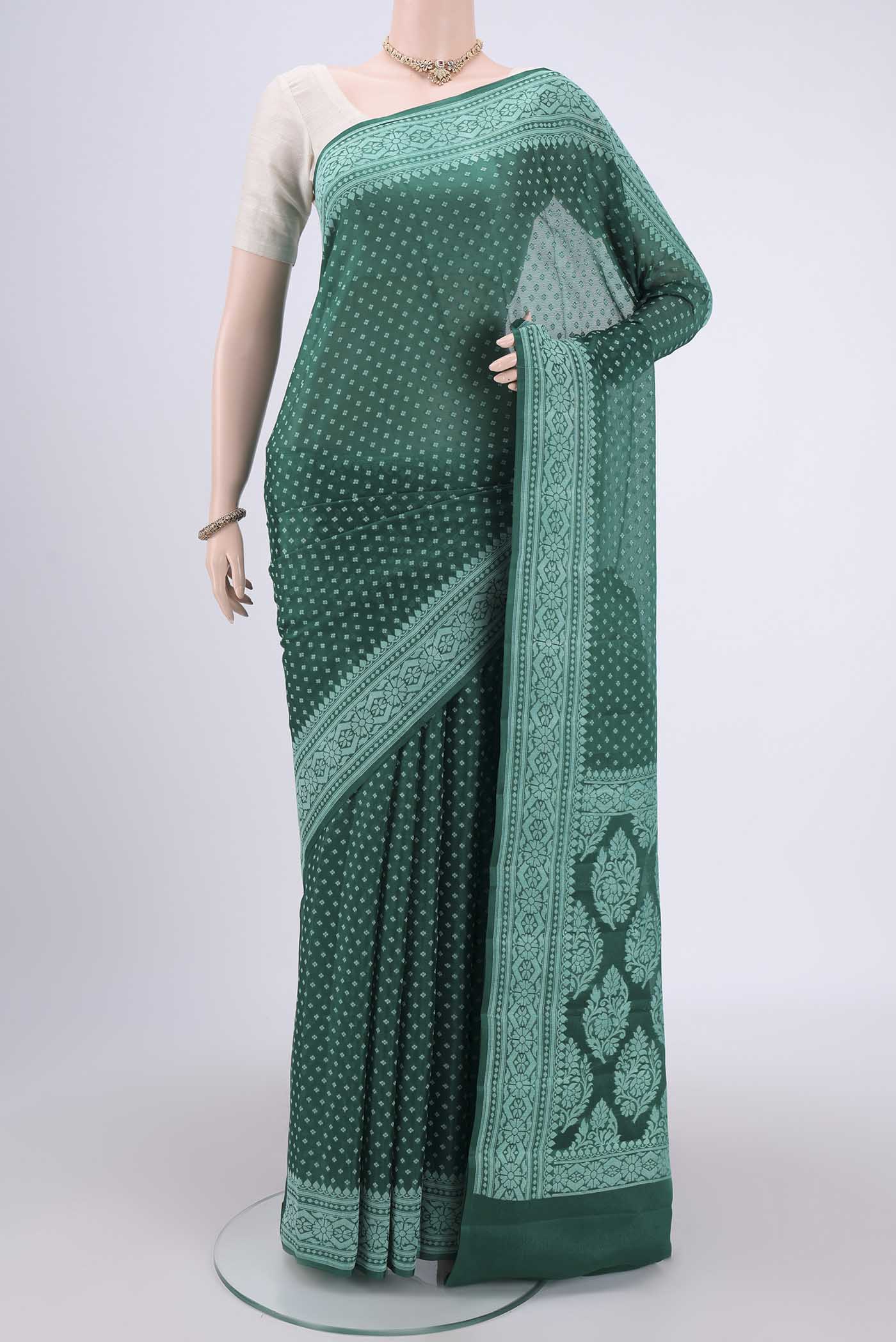 Green Blended Banarasi Georgette Saree with Thread Butta on the body and Thread Border.  displayed on a mannequin