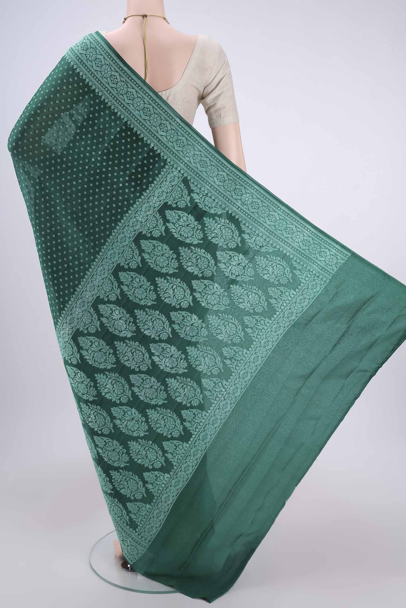 Flat view of Green Blended Banarasi Georgette Saree with Thread Butta on the body and Thread Border. 
