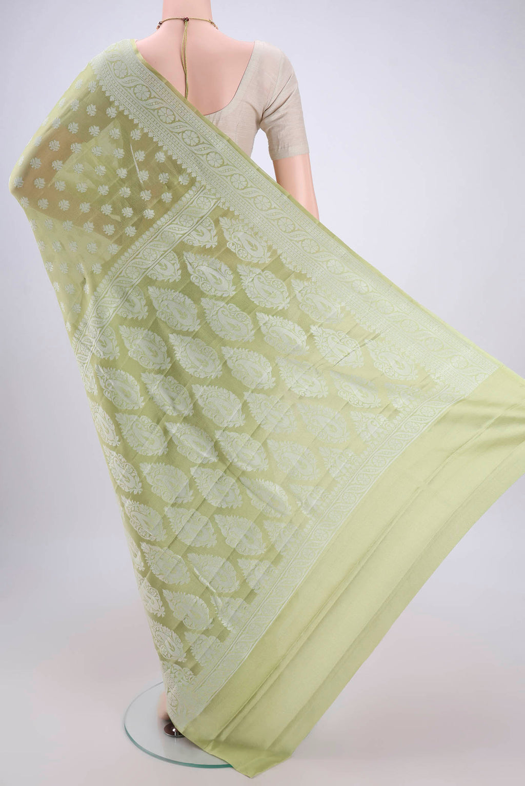 Flat view of Pista Green Blended Banarasi Georgette Saree with Thread Butta on the body and Thread Border. 