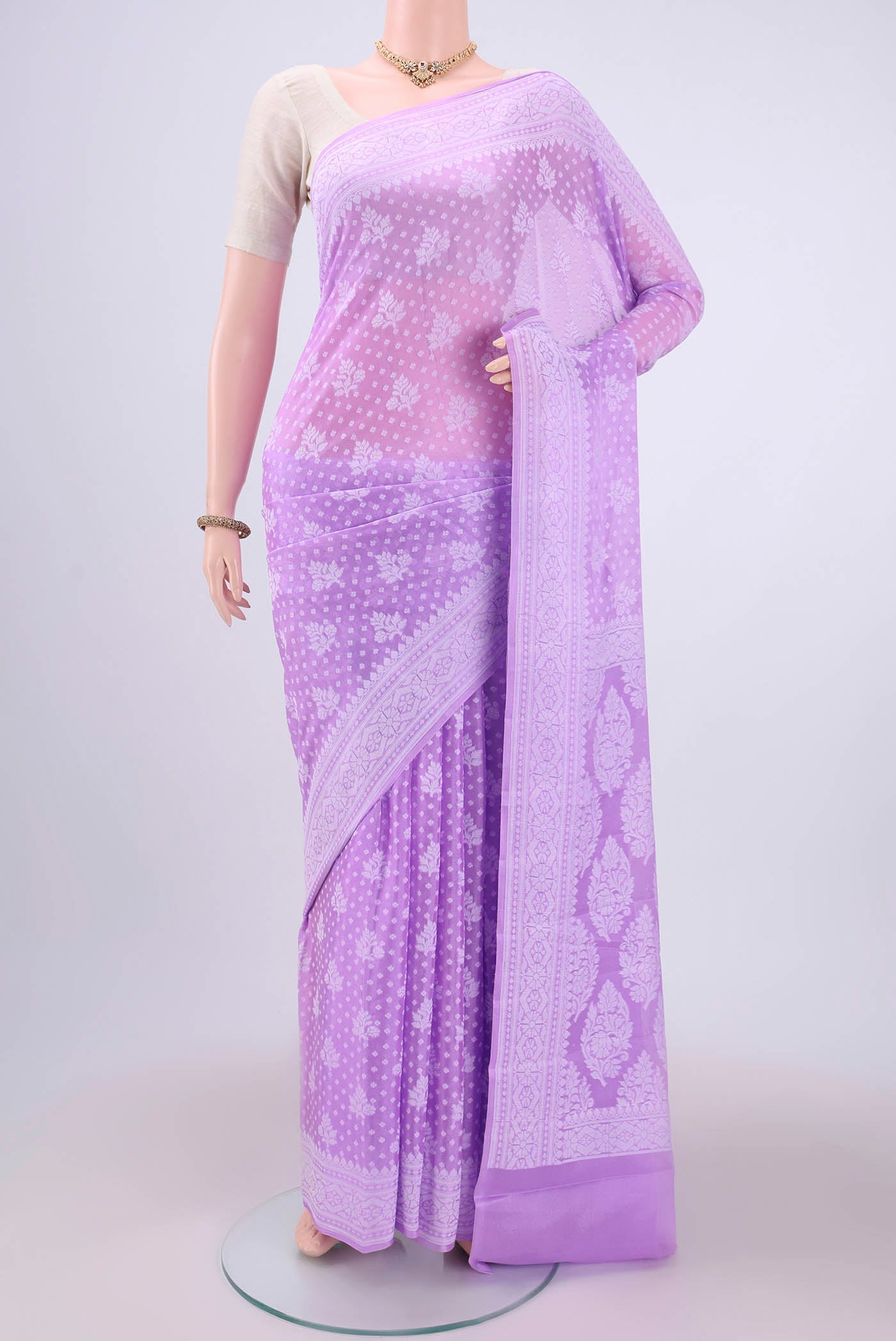 Lilac Blended Banarasi Georgette Saree with Thread Butta on the body and Thread Border.  displayed on a mannequin