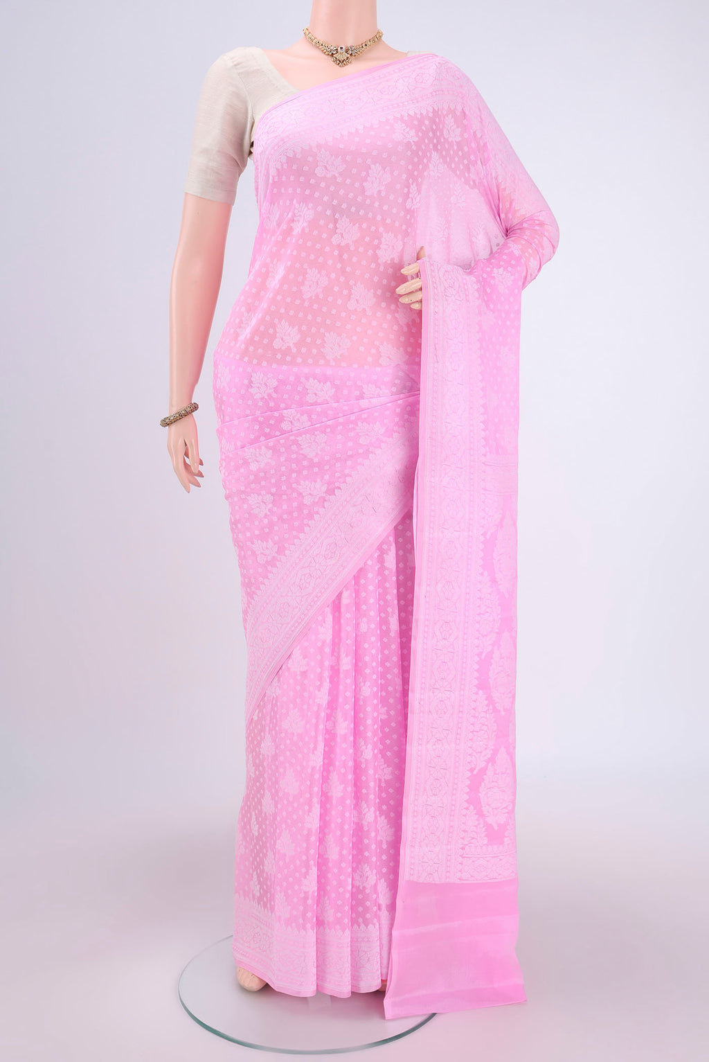 Rose pink Blended Banarasi Georgette Saree with Thread Butta on the body and Thread Border.  displayed on a mannequin