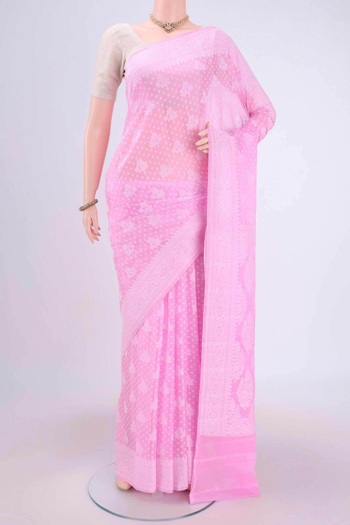 Rose pink Blended Banarasi Georgette Saree with Thread Butta on the body and Thread Border.  displayed on a mannequin