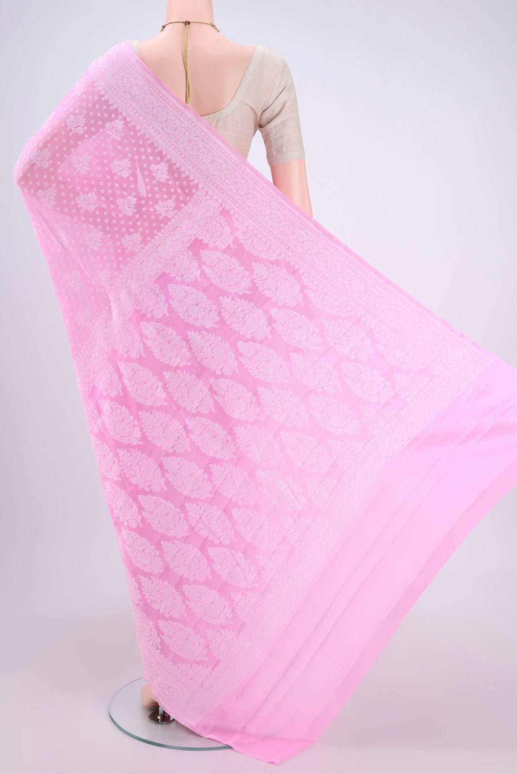 Flat view of Rose pink Blended Banarasi Georgette Saree with Thread Butta on the body and Thread Border. 