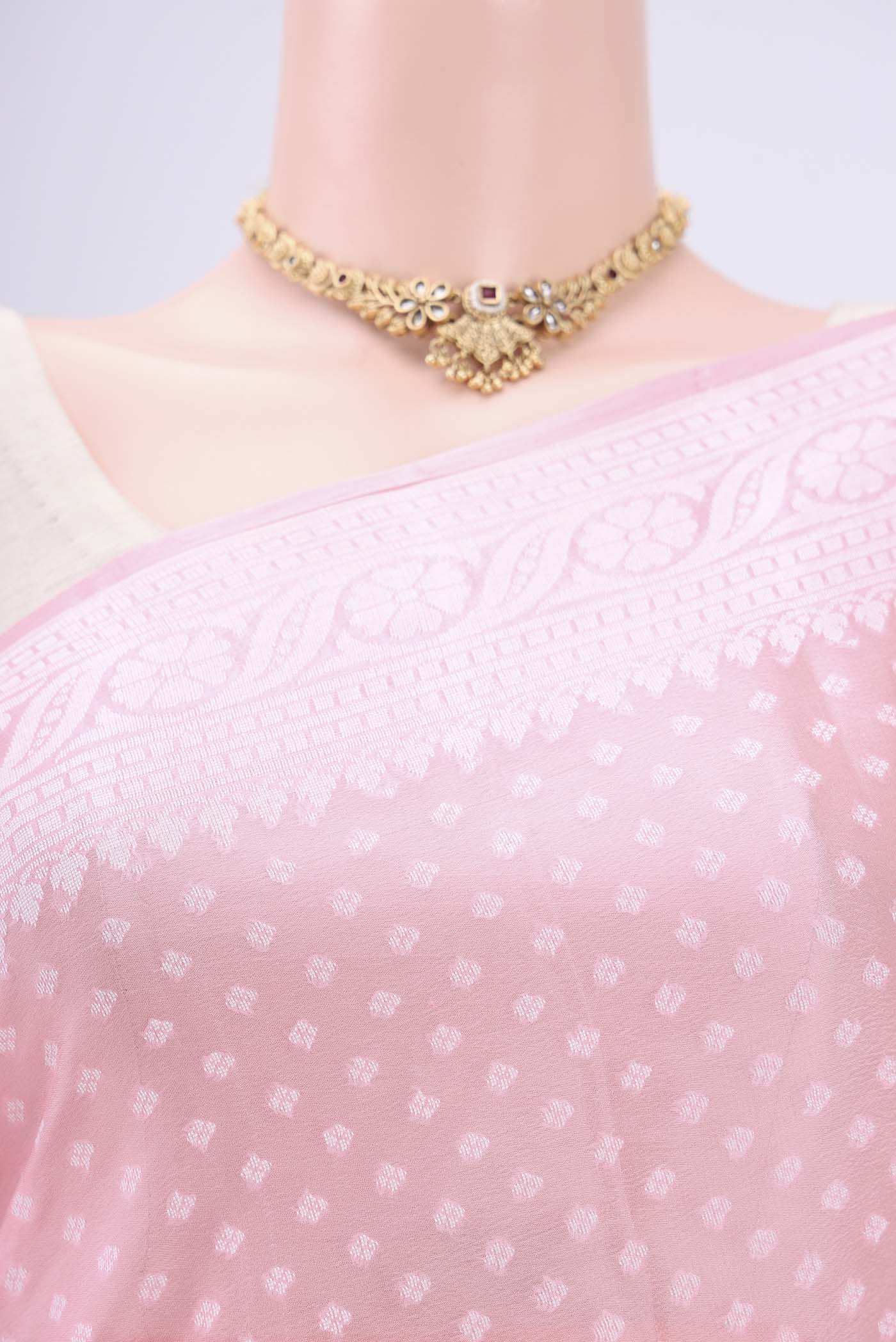 Border image of Peach Blended Banarasi Georgette Saree with Thread Butta on the body and Thread Border. 