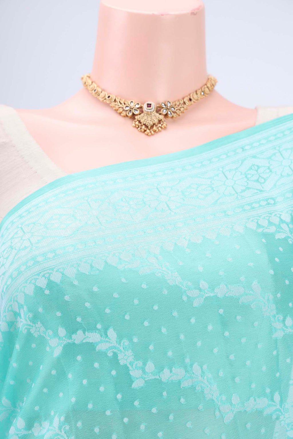 Border image of Turquoise Blended Banarasi Georgette Saree with Thread Brocade on the body and Zari Border. 