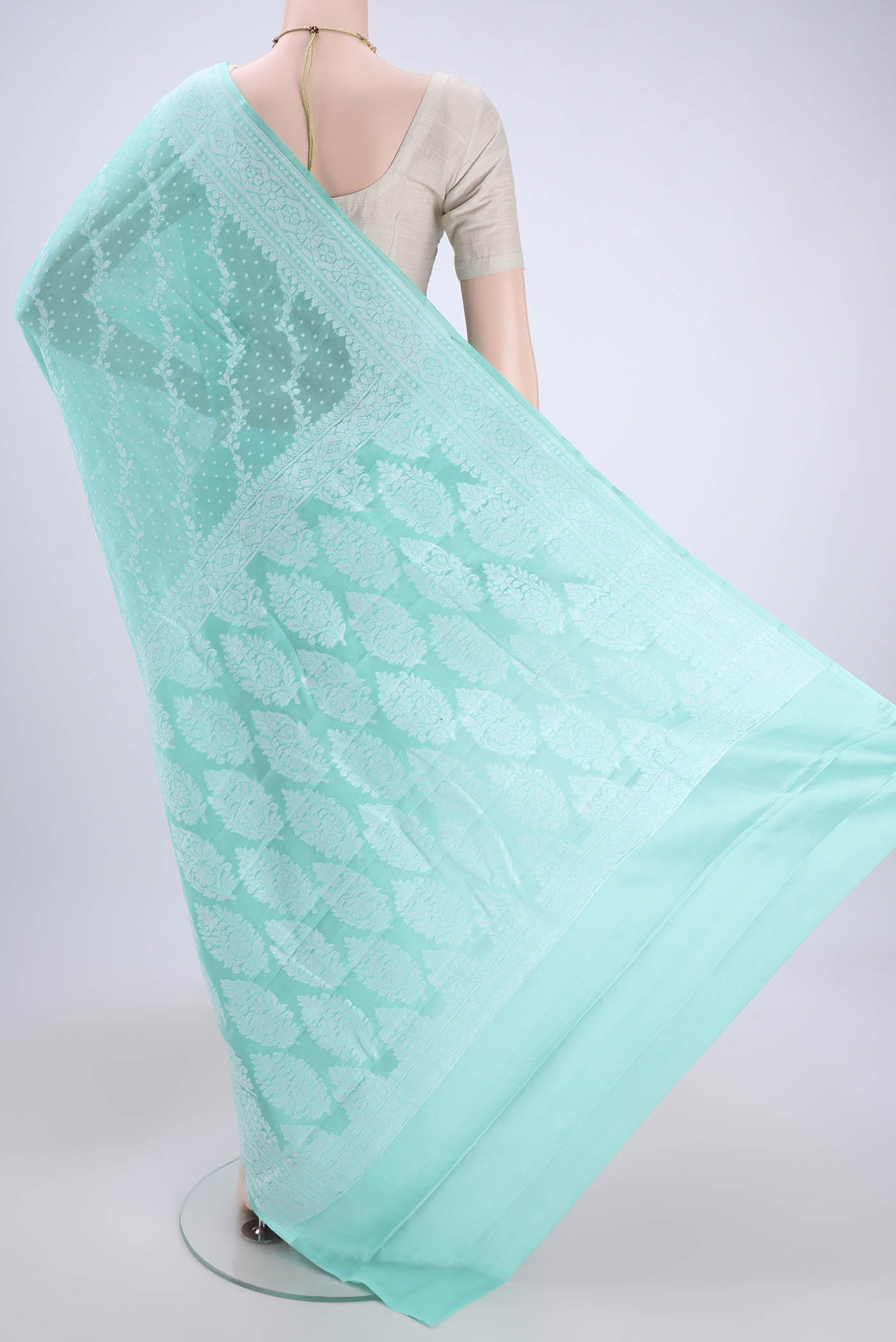 Flat view of Turquoise Blended Banarasi Georgette Saree with Thread Brocade on the body and Zari Border. 