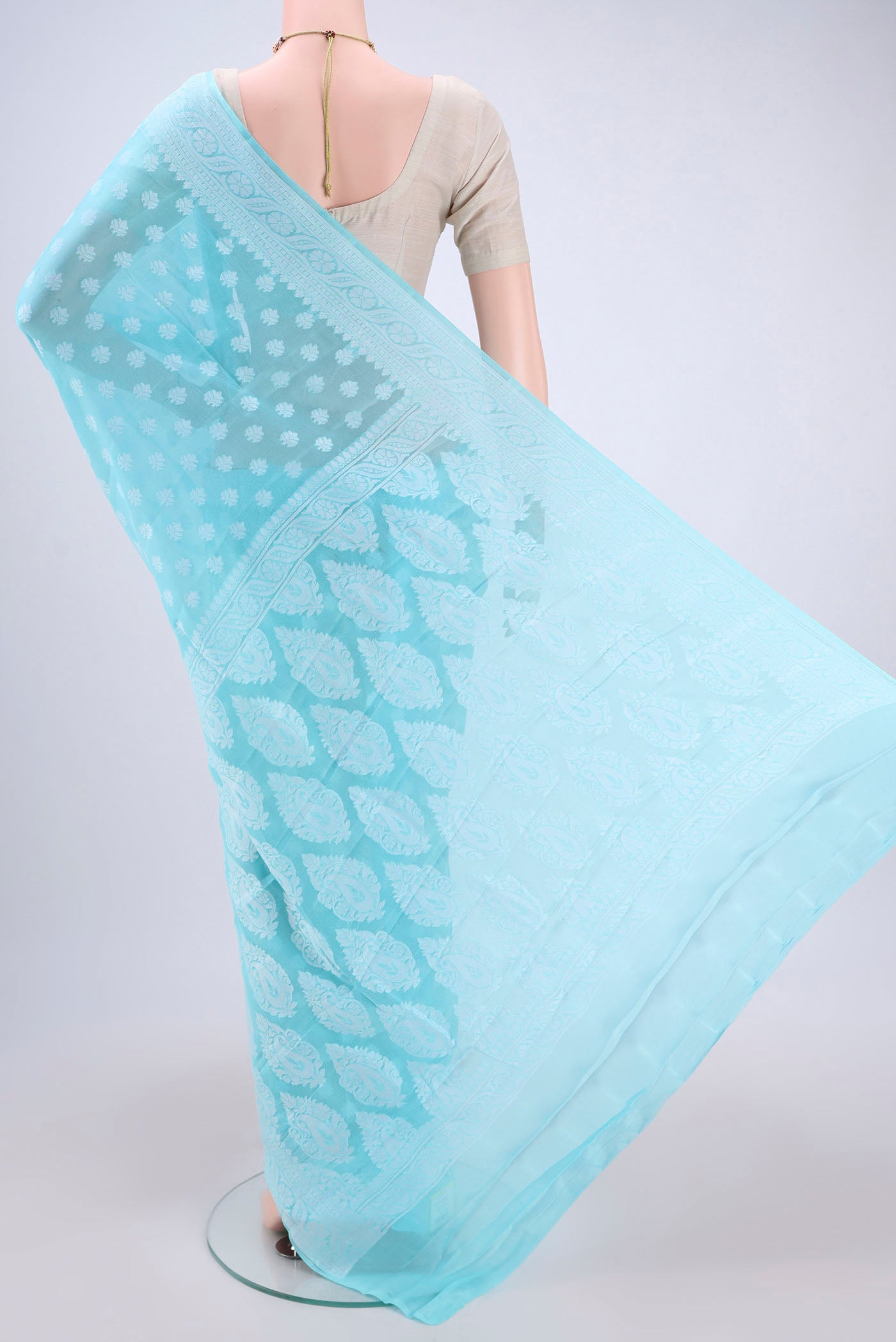 Flat view of Sky Blue Blended Banarasi Georgette Saree with Thread Butta on the body and Thread Border. 