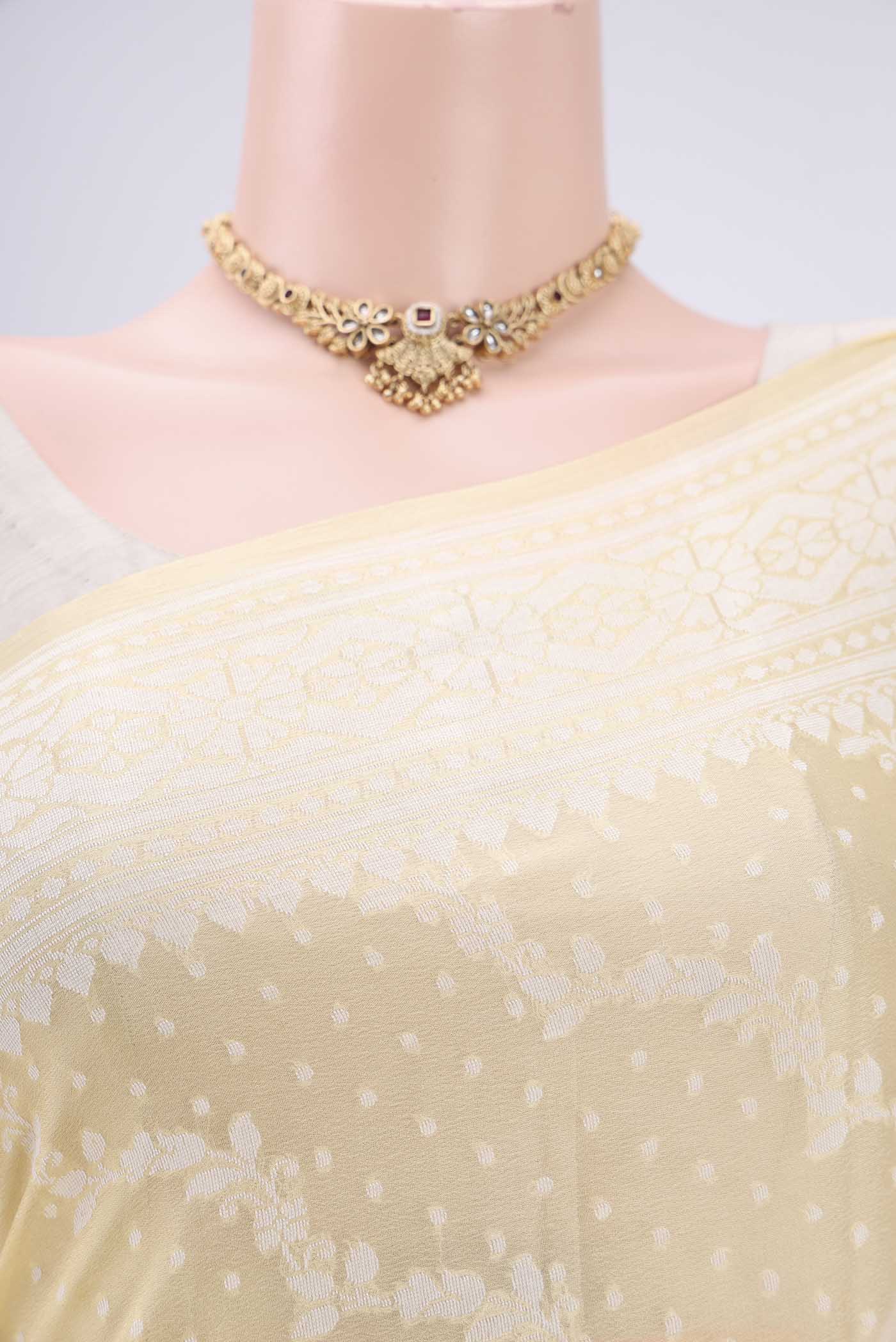 Border image of Lemon Yellow Blended Banarasi Georgette Saree with Thread Brocade on the body and Zari Border. 