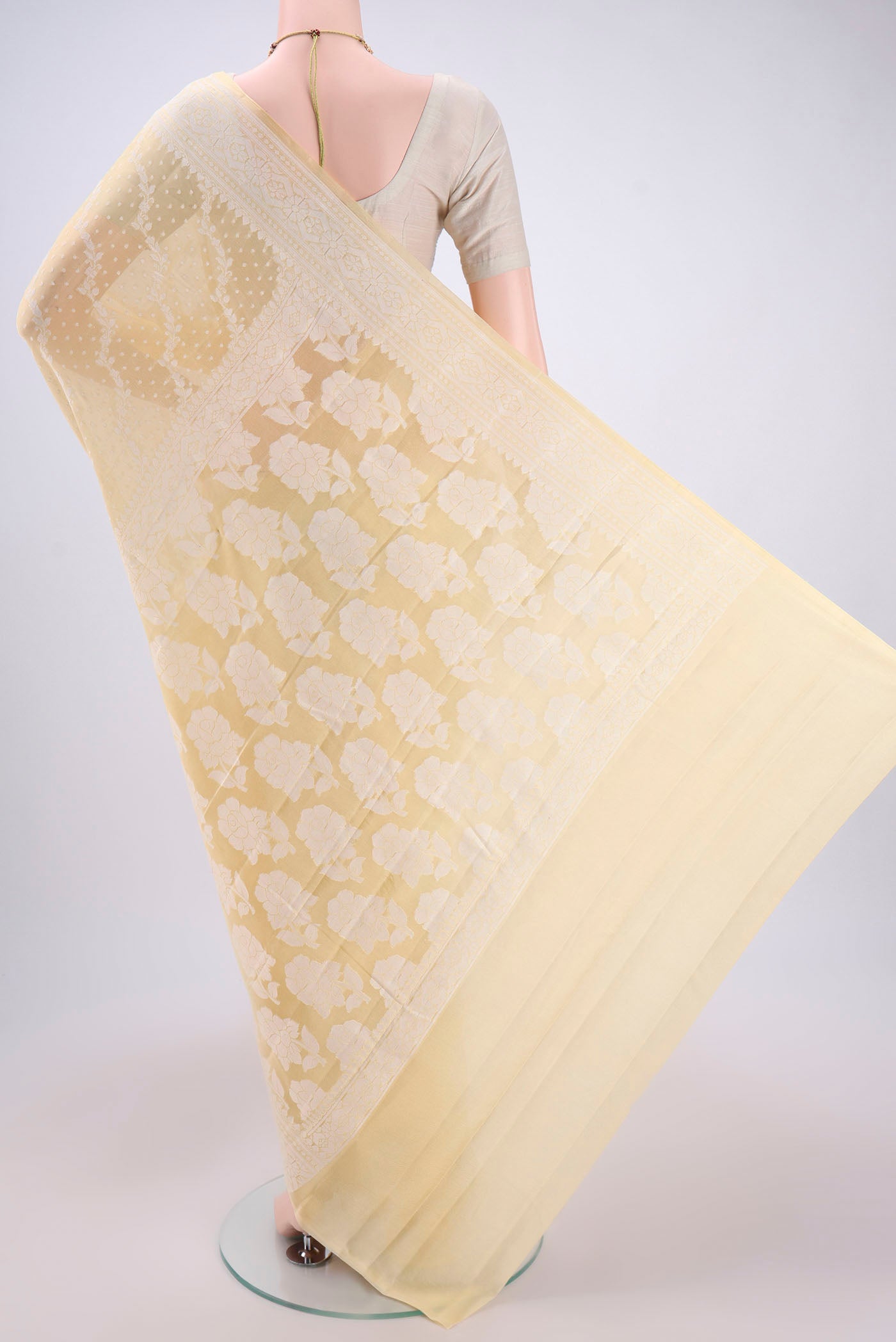 Flat view of Lemon Yellow Blended Banarasi Georgette Saree with Thread Brocade on the body and Zari Border. 
