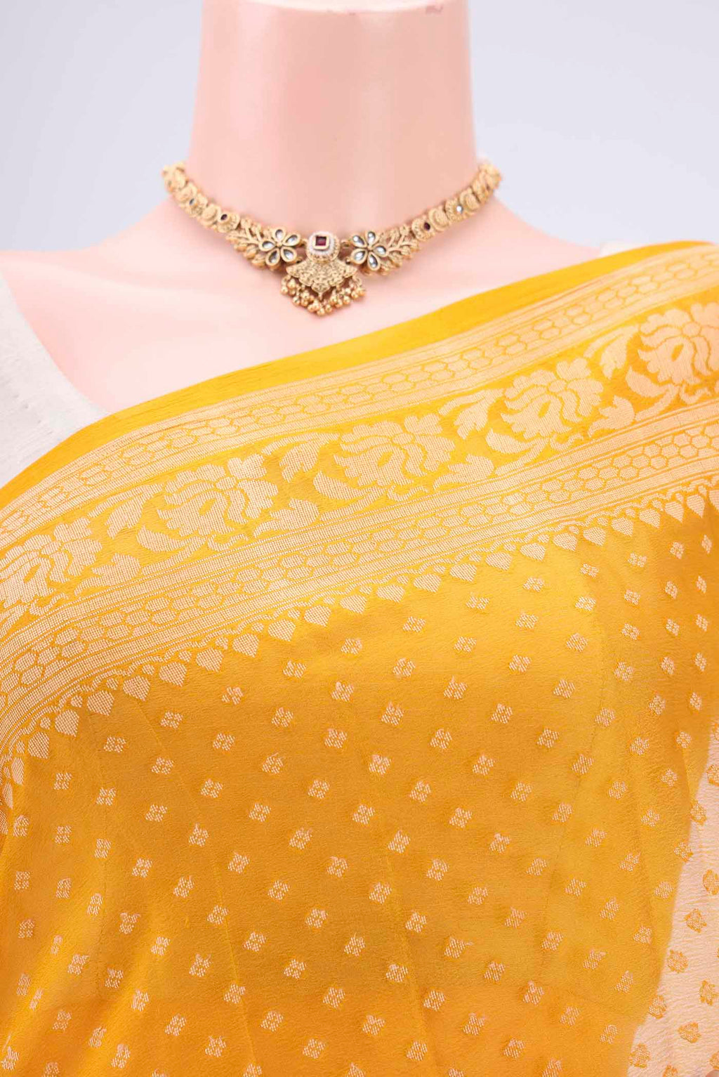 Border image of Mustard Blended Banarasi Georgette Saree with Thread Butta on the body and Thread Border. 